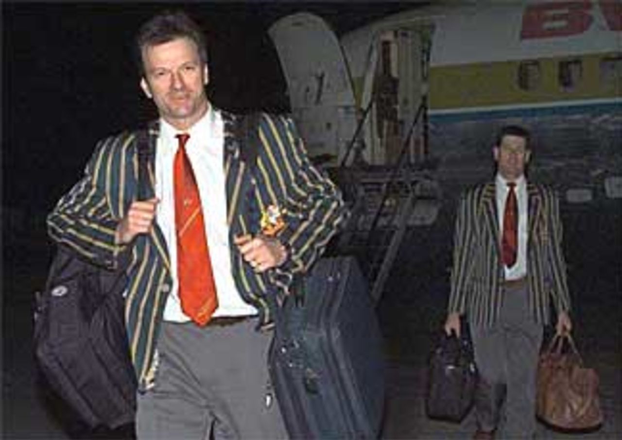 Steve Waugh, newly named captain of the Australian cricket team, left, arrives at the V.C. Bird airport in St. John's, Antigua, Friday, February 19, 1999, for the Australian tour of the West Indies. Australia will play a three-day exhibition mat