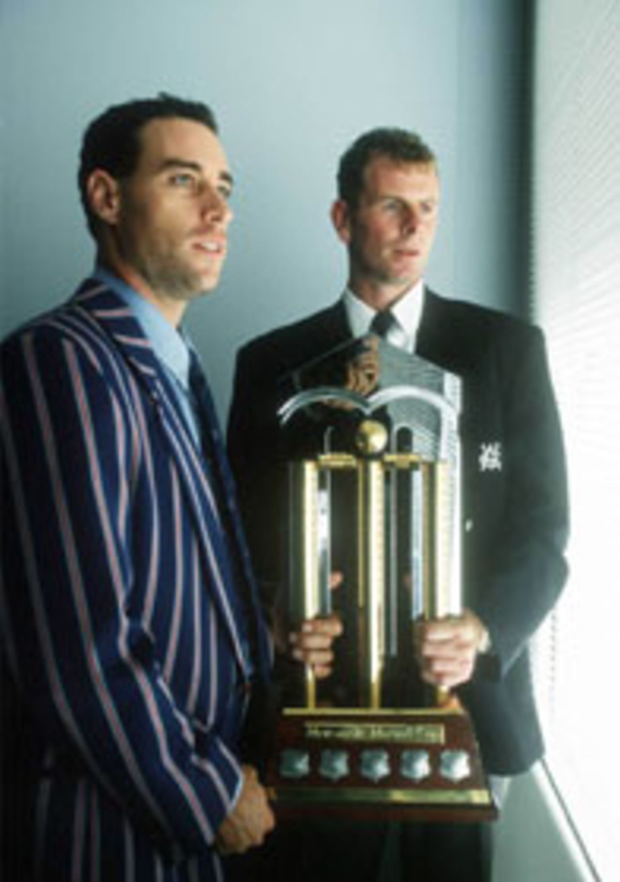 Paul Reiffel and Michael Bevan hold the Mercantile Mutual Cup ahead of the 1998/99 Mercantile Mutual Cup Final, February, 25 1999/