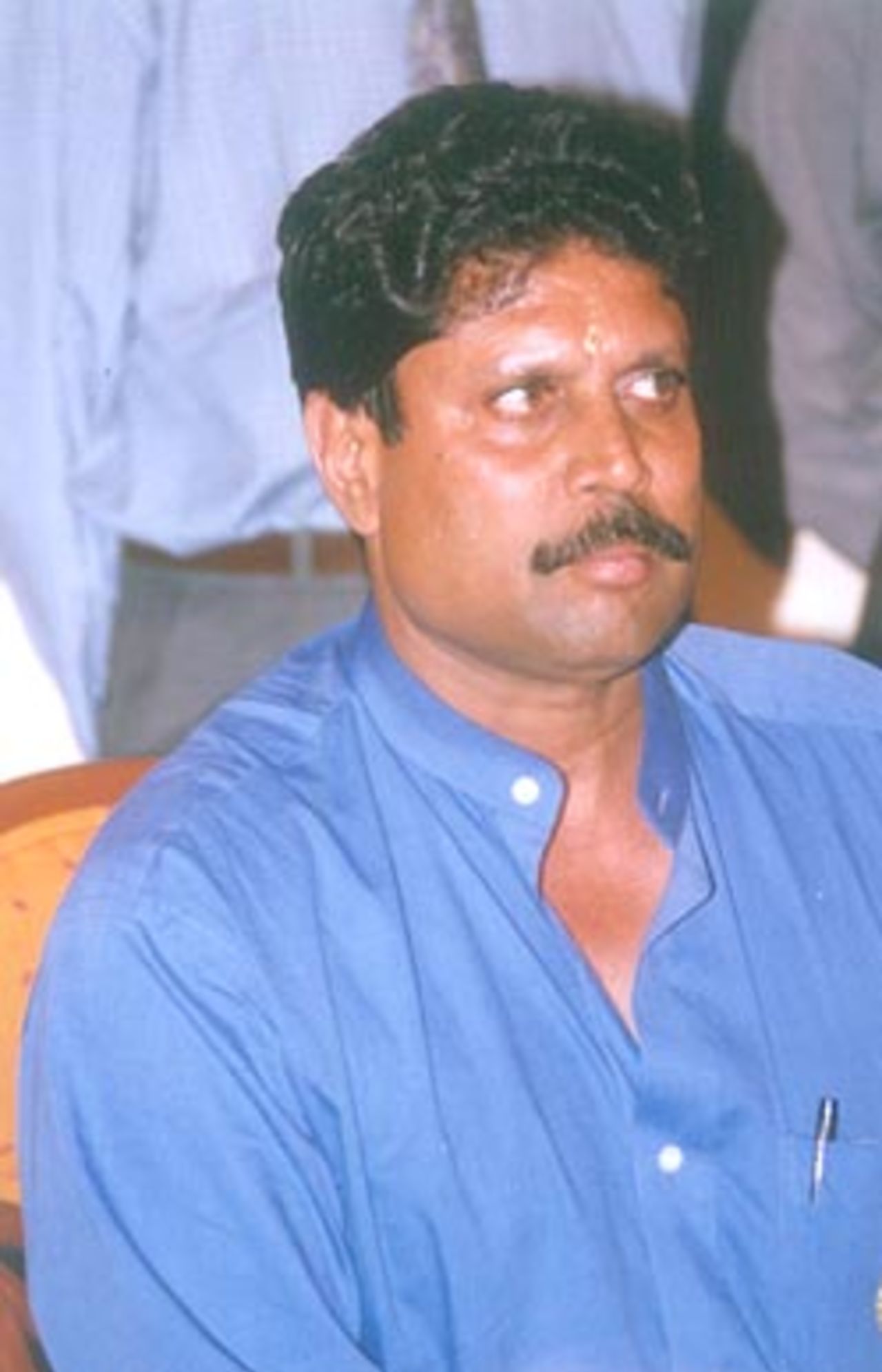 Kapil Dev listening to questions at the press meet, Chennai, 01 Febuary 2000