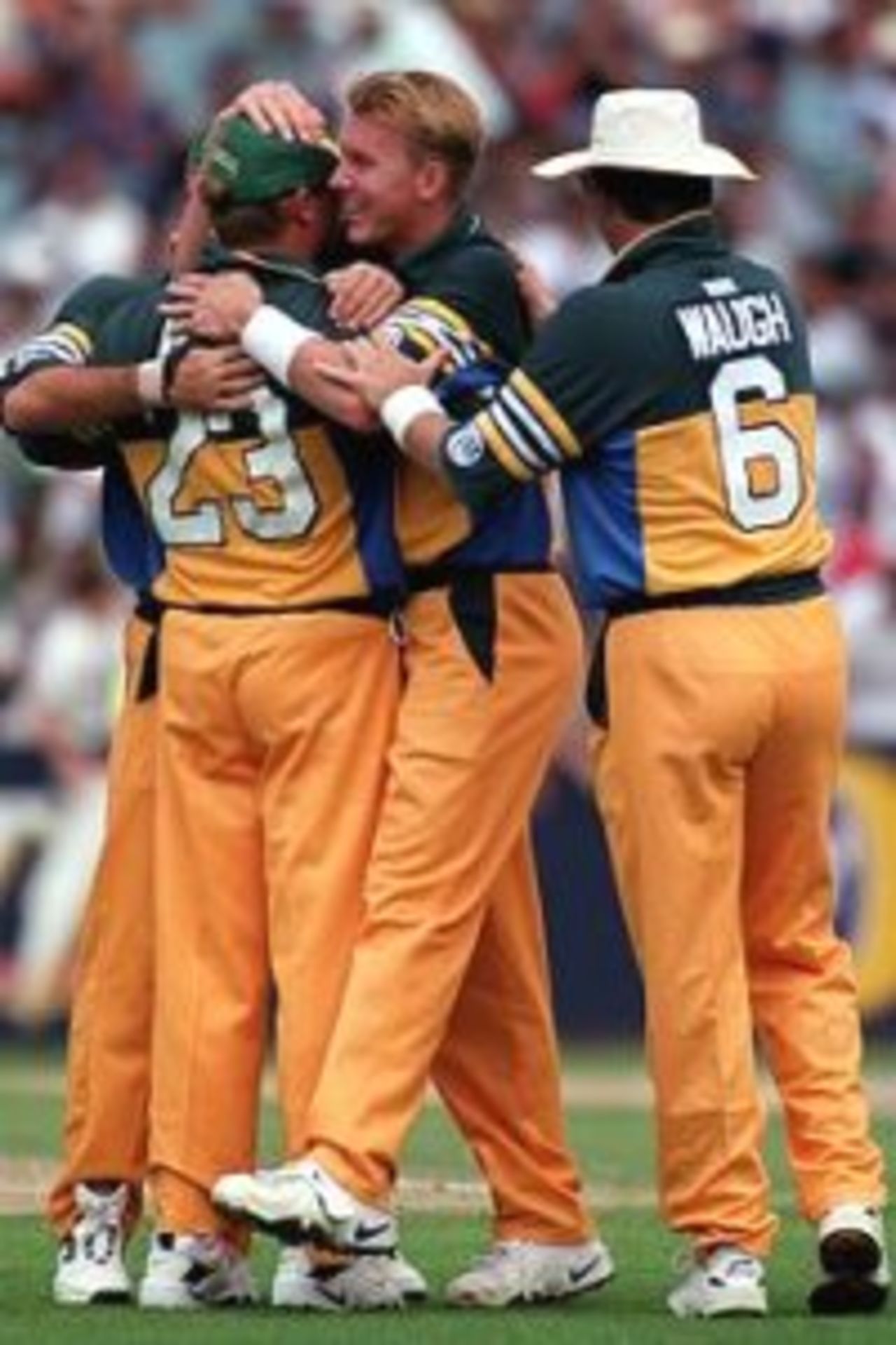 2 Feb 2000: Australian fast bowler Brett Lee is congratulated by team mates after claiming the wicket of Pakistan batsman Saeed Anwar during the first final of the one day international between Australia and Pakistan played at the MCG, Melbourne, Australia.