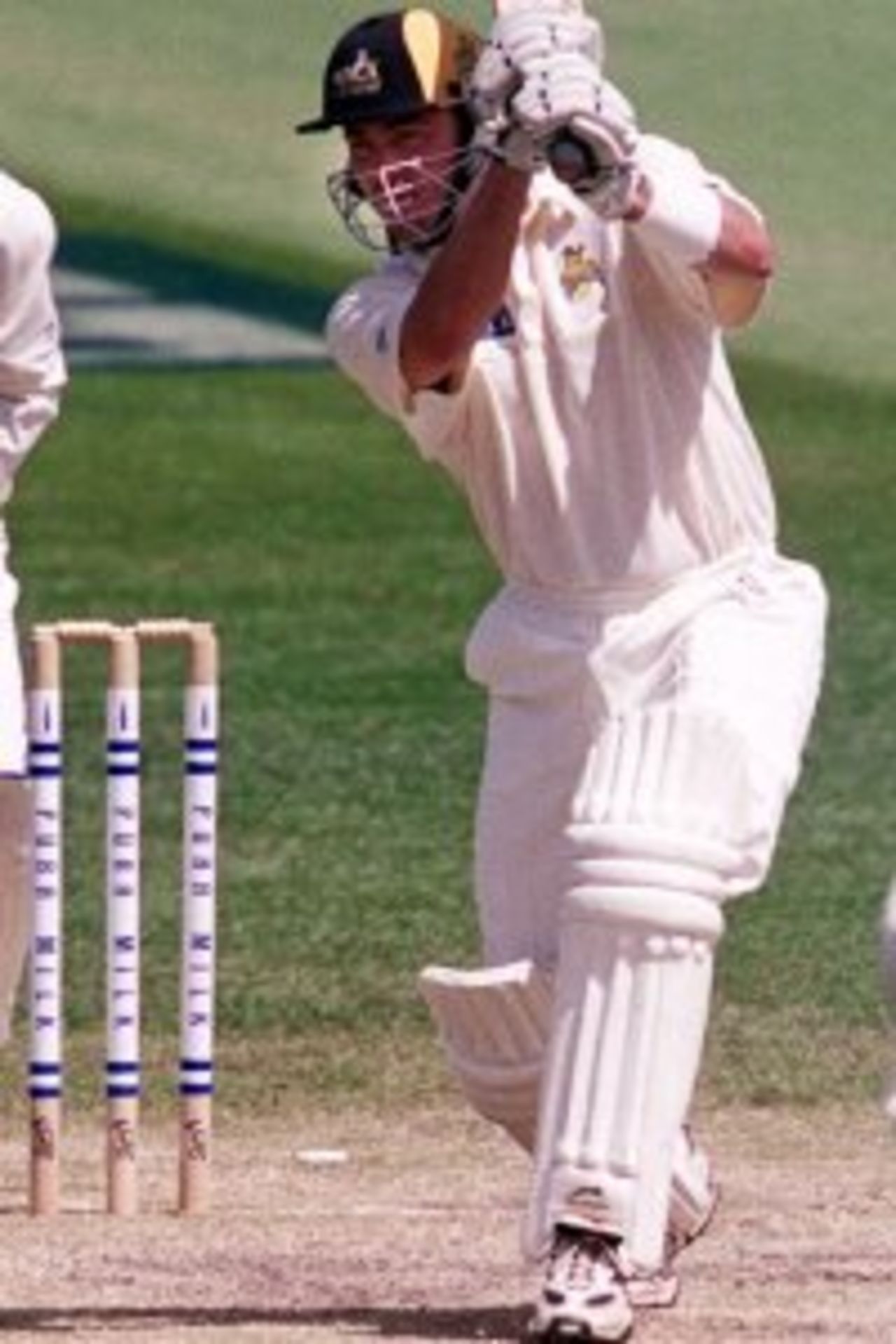2 Dec 1999: Damien Martyn of Western Australia drives strongly with wicketkeeper Darren Berry and bowler Jon Davison of Victoria looking on, on day two of the Pura Milk Cup match between Victoria and Western Australia, played at the Melbourne Cricket Ground, Melbourne, Australia.
