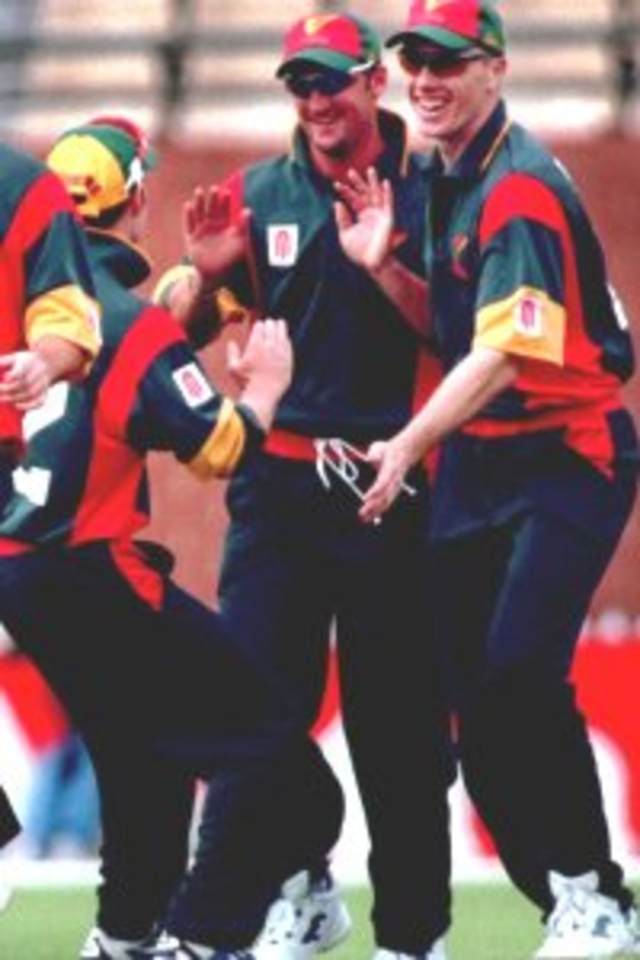 17 Oct 1999: Tasmanian bowler Mark Ridgway celebrates with teamates after taking the wicket of South Australia's Shane Deitz (0) in the first over, caught by Daniel Marsh during the Mercantile Mutual match between the South Australia Redbacks v Tasmania Tigers at the Adelaide Oval, Adelaide, Australia.