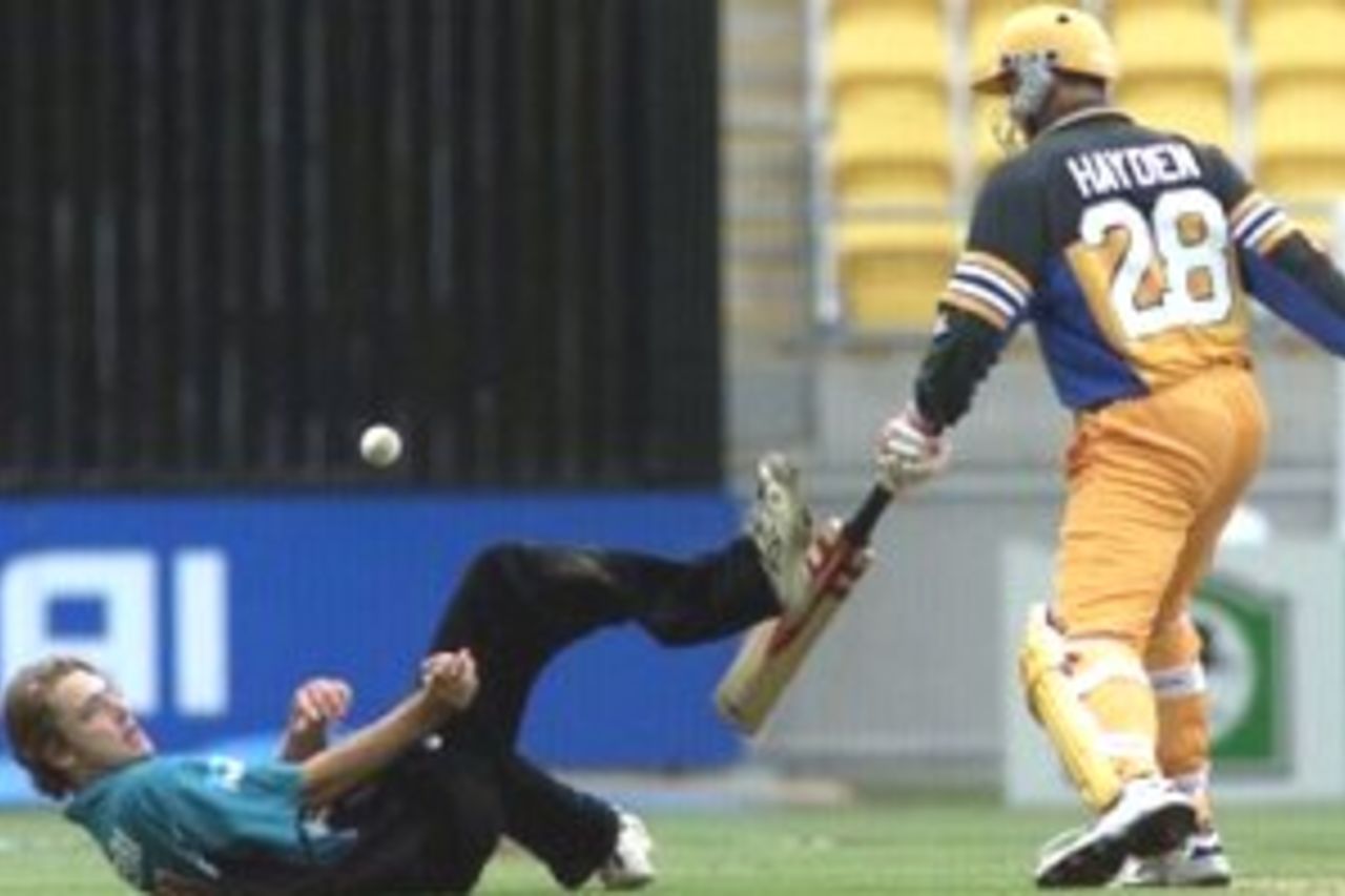 17 Feb 2000: Danierl Vettori of New Zealand dives to field with Matthew Hayden of Australia looking on during the first one day international between Australia and New Zealand at WestpacTrust Stadium, Wellington, New Zealand.