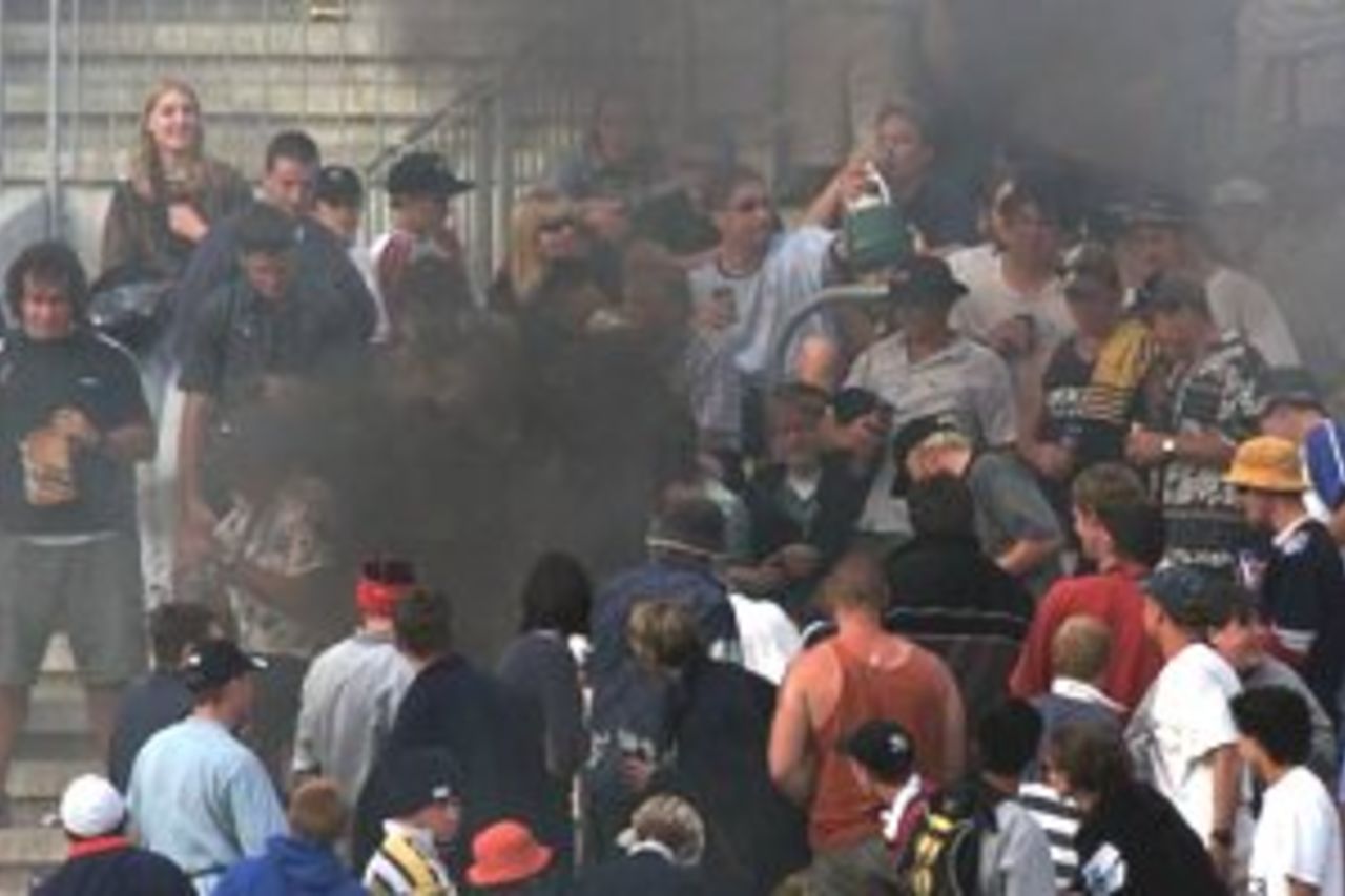23 Feb 2000: Fans start a fire in the stands, during the third one day international between New Zealand and Australia at Carisbrook, Dunedin, New Zealand.