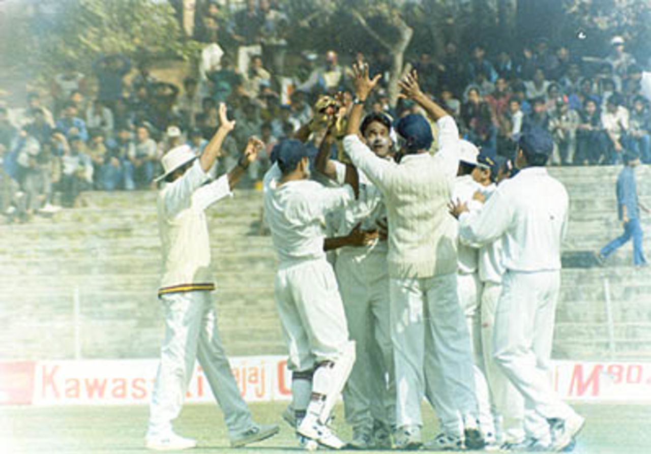 Debashish Mohanty being congratulated by his team after he achieved the 'Perfect 10', Duleep Trophy, 2000/01, East Zone v South Zone, Maharaja Bir Bikram College Stadium, Agartala, 25-27 January 2001.