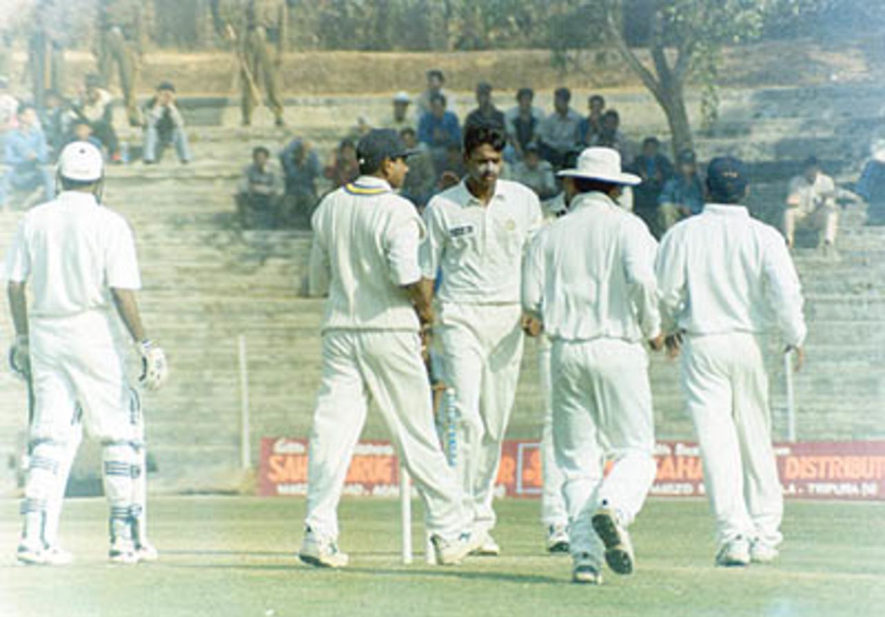 East Zone players rush to Mohanty when he bowled Laxman, Duleep Trophy, 2000/01, East Zone v South Zone, Maharaja Bir Bikram College Stadium, Agartala, 25-27 January 2001.