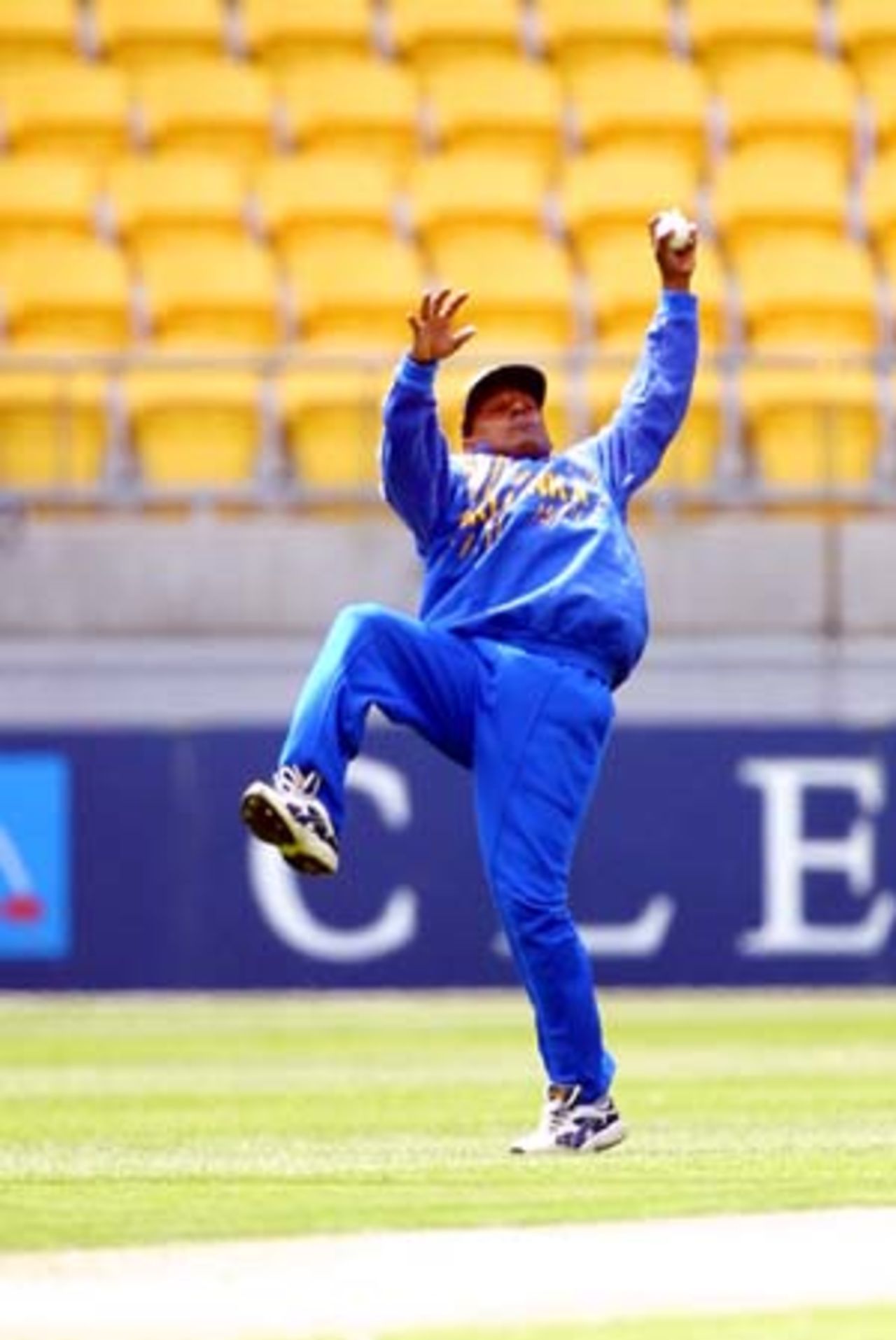 Sri Lankan fielder Aravinda de Silva leaps back at mid on to take a spectacular one-handed catch to dismiss New Zealand opening batsman Nathan Astle for 17 from the bowling of Nuwan Zoysa. 2nd One-Day International: New Zealand v Sri Lanka at WestpacTrust Stadium, Wellington, 3 February 2001.