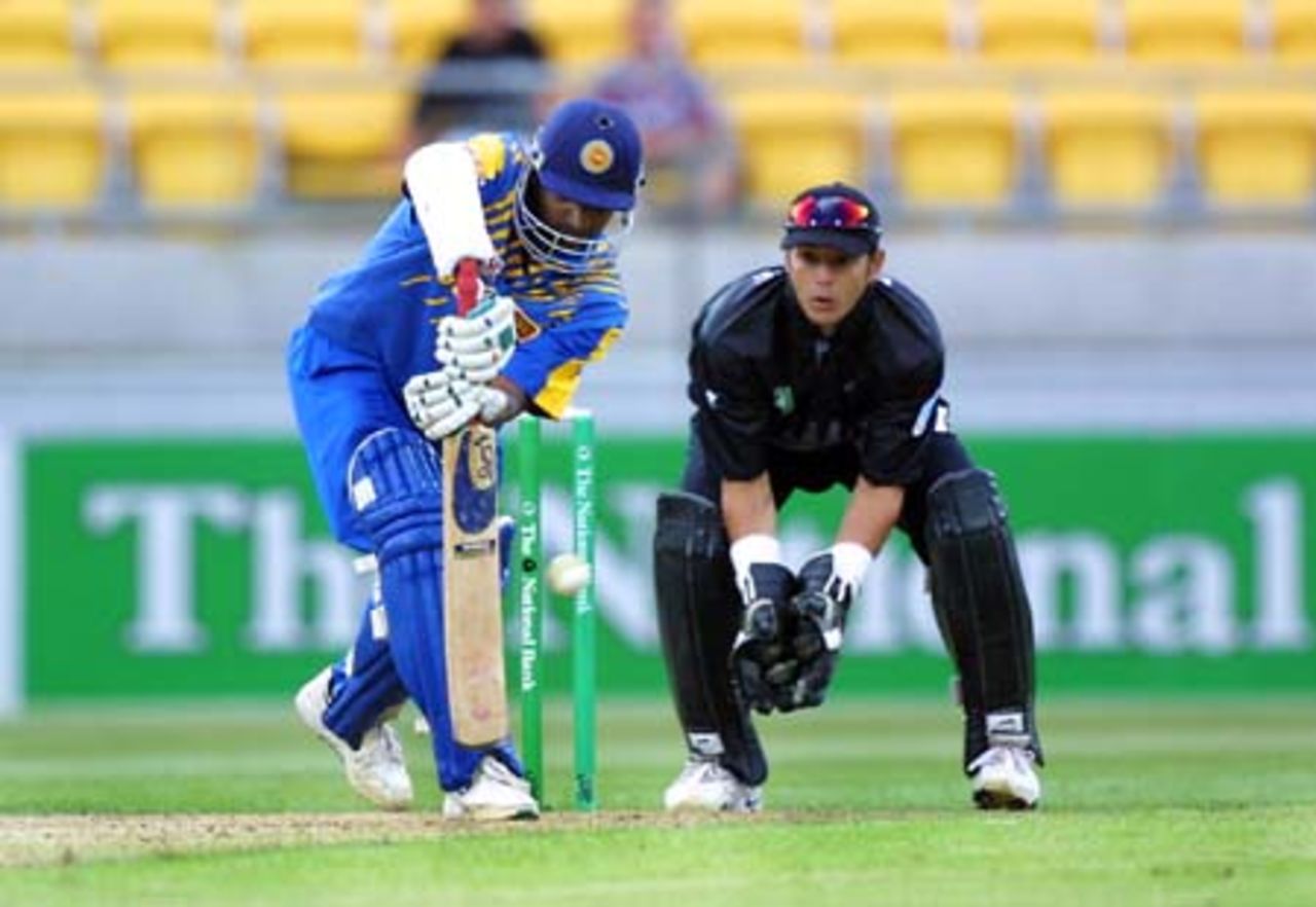Sri Lankan opening batsmen Sanath Jayasuriya defends a delivery from New Zealand bowler Daniel Vettori during his innings of 38 while wicket-keeper Adam Parore looks on. 2nd One-Day International: New Zealand v Sri Lanka at WestpacTrust Stadium, Wellington, 3 February 2001.