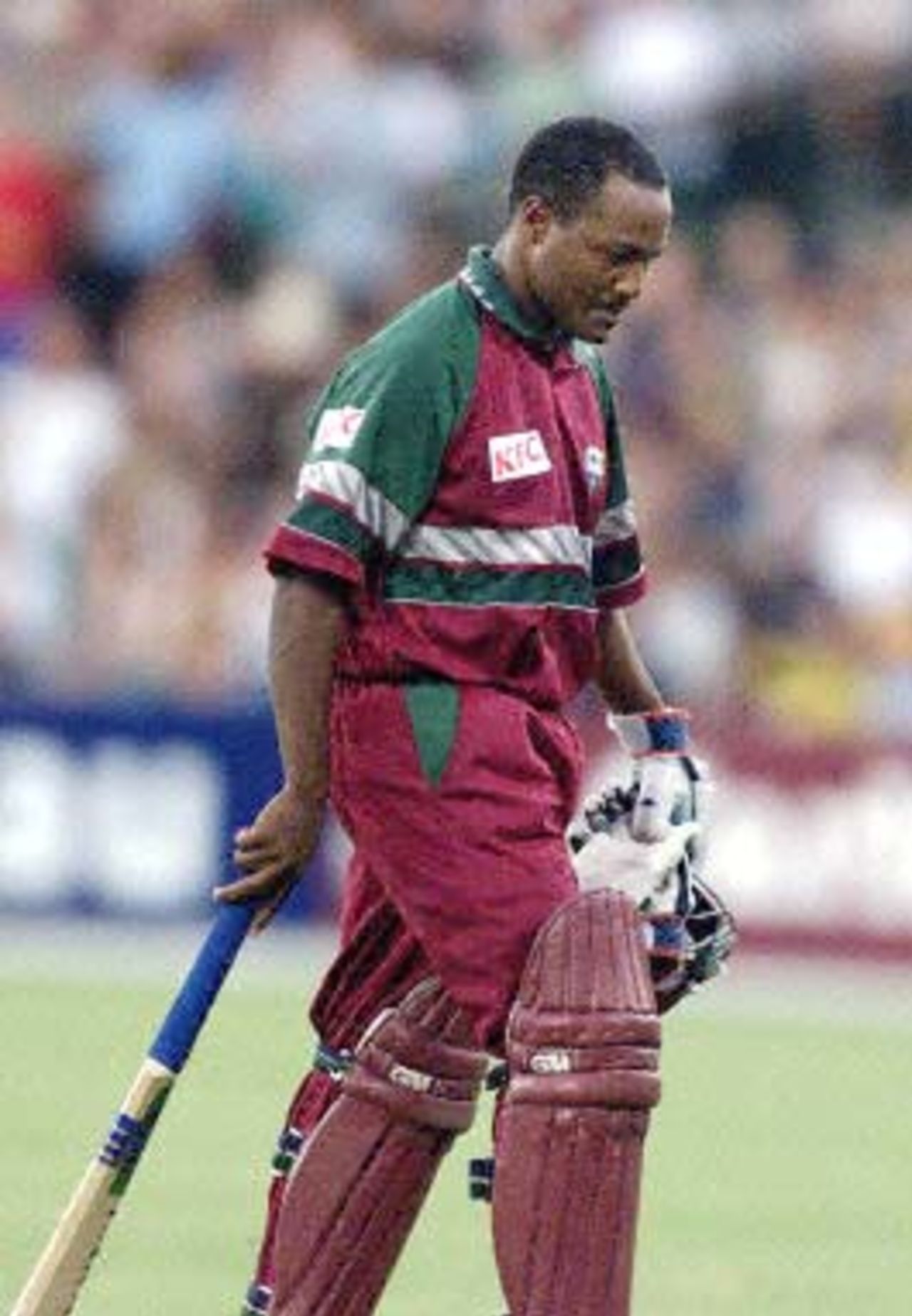 West Indies batsman Brian Lara walks dejected after being caught by Australian wicket-keeper Adam Gilchrist off the bowling of Damien Fleming at first Final of the Tri Nations series in Sydney 07 February 2001. Lara made seven boundarys from 38 balls as the West Indies chased the Australian total of 253. The West Indies are currently 7/85.