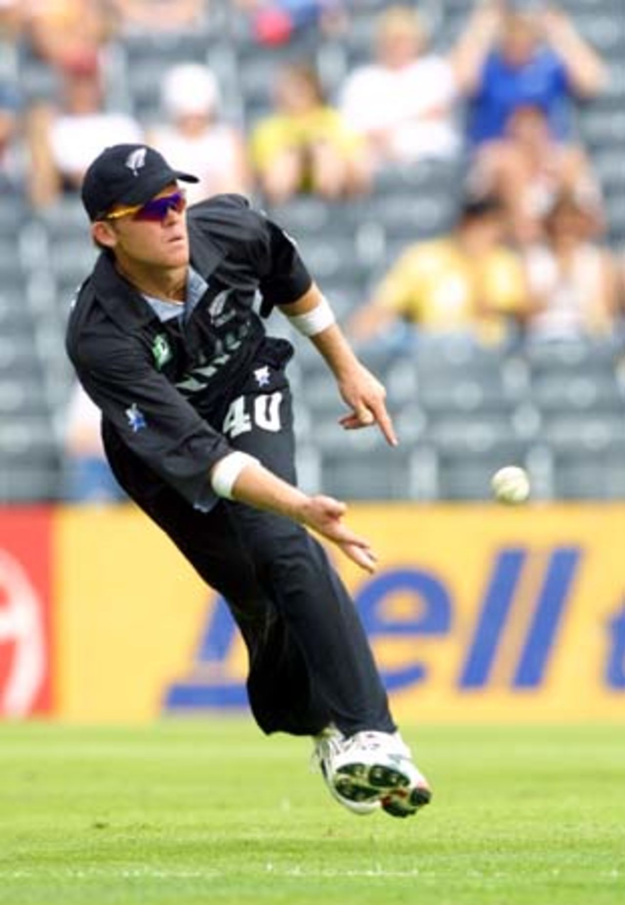 New Zealand fielder Lou Vincent sends in an under-arm return to the wicket-keeper as the Sri Lankan batsmen hurry through for a quick run. 5th One-Day International: New Zealand v Sri Lanka at Jade Stadium, Christchurch, 11 February 2001.