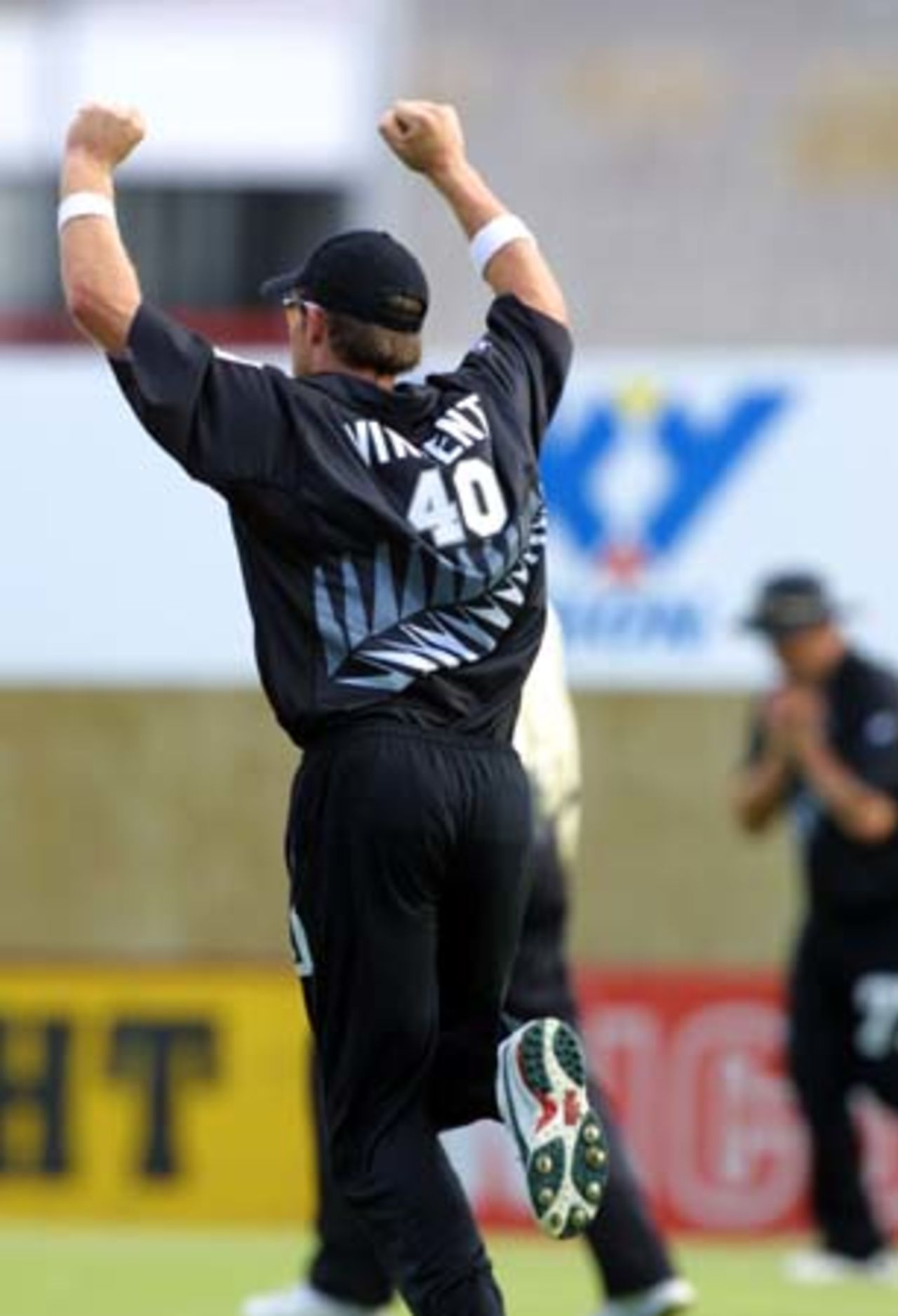 New Zealand fielder Lou Vincent celebrates the dismissal of Sri Lankan batsman Russel Arnold, caught by Roger Twose (in the background) off the bowling of Craig McMillan for 51. 5th One-Day International: New Zealand v Sri Lanka at Jade Stadium, Christchurch, 11 February 2001.