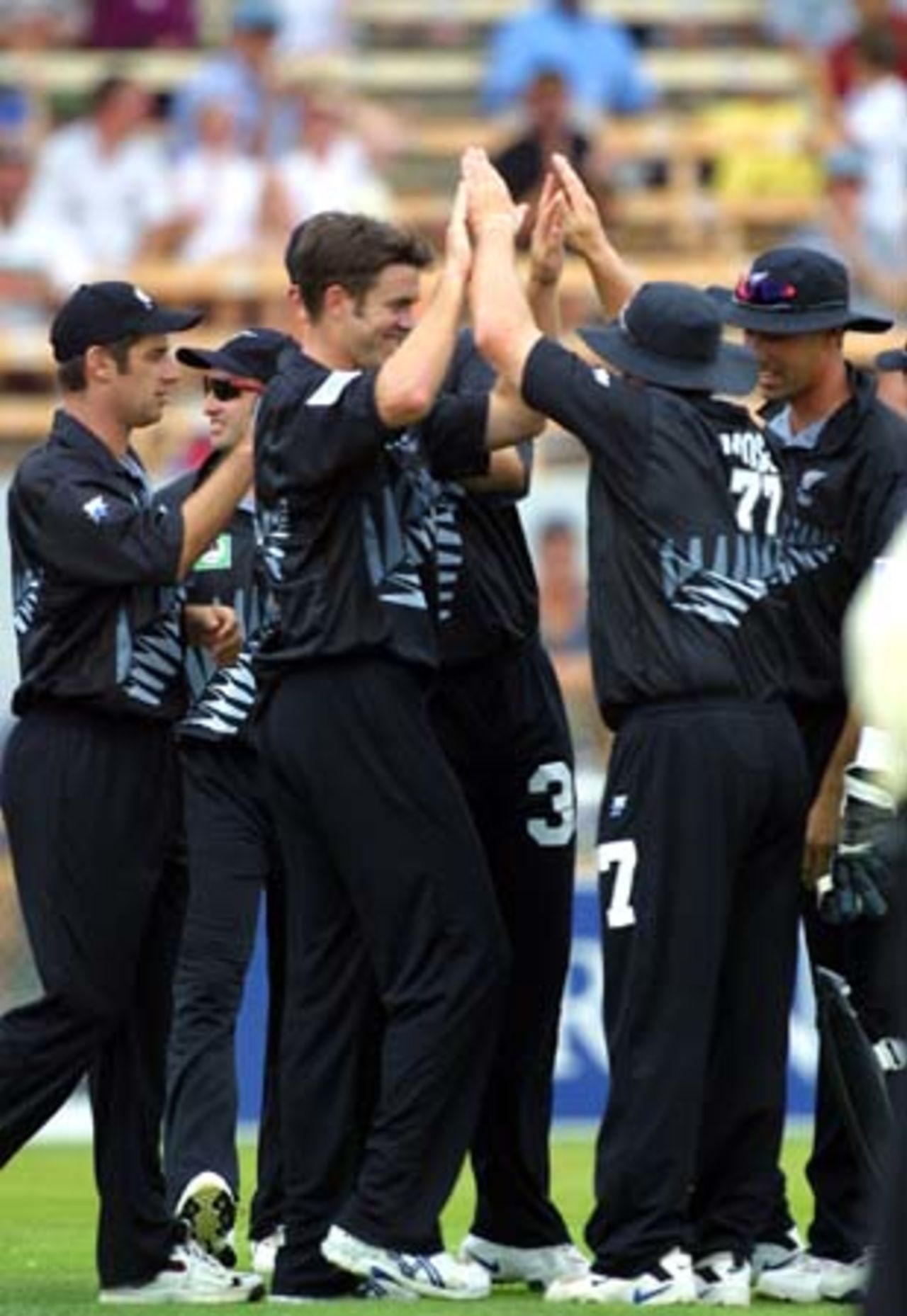 New Zealand left arm fast medium bowler James Franklin high-fives fielder Roger Twose in celebration of the dismissal of Sri Lankan batsman Aravinda de Silva, caught by Stephen Fleming (right) at slip for 5. Teammates Craig Spearman (left), Chris Harris, Jacob Oram (obscured), Adam Parore (obscured) also join in the celebrations. 5th One-Day International: New Zealand v Sri Lanka at Jade Stadium, Christchurch, 11 February 2001.