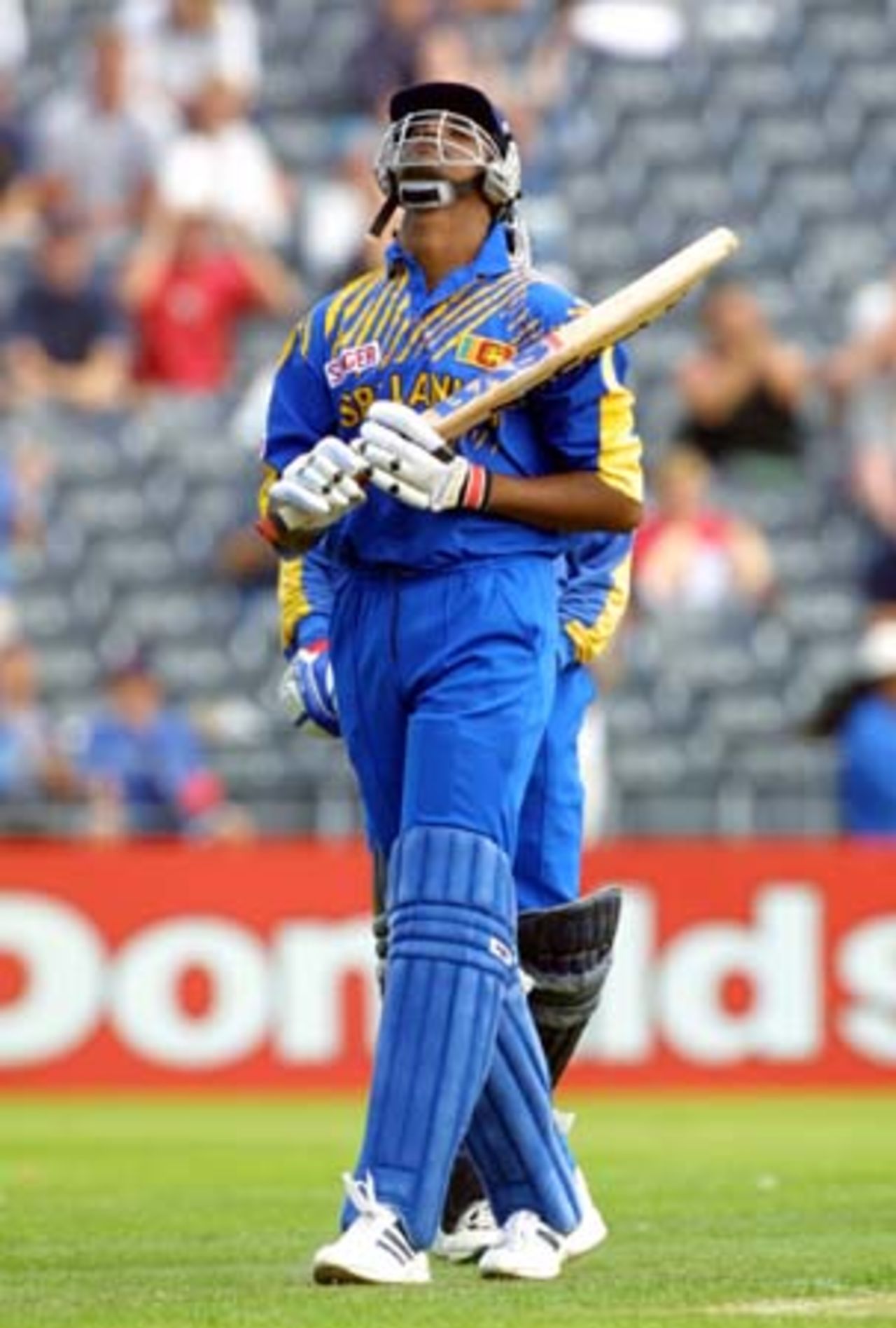 Sri Lankan lower order batsman Nuwan Zoysa looks skyward in disappointment at being dismissed by New Zealand right arm fast medium bowler Daryl Tuffey, caught by Daniel Vettori at long on for 32. 5th One-Day International: New Zealand v Sri Lanka at Jade Stadium, Christchurch, 11 February 2001.