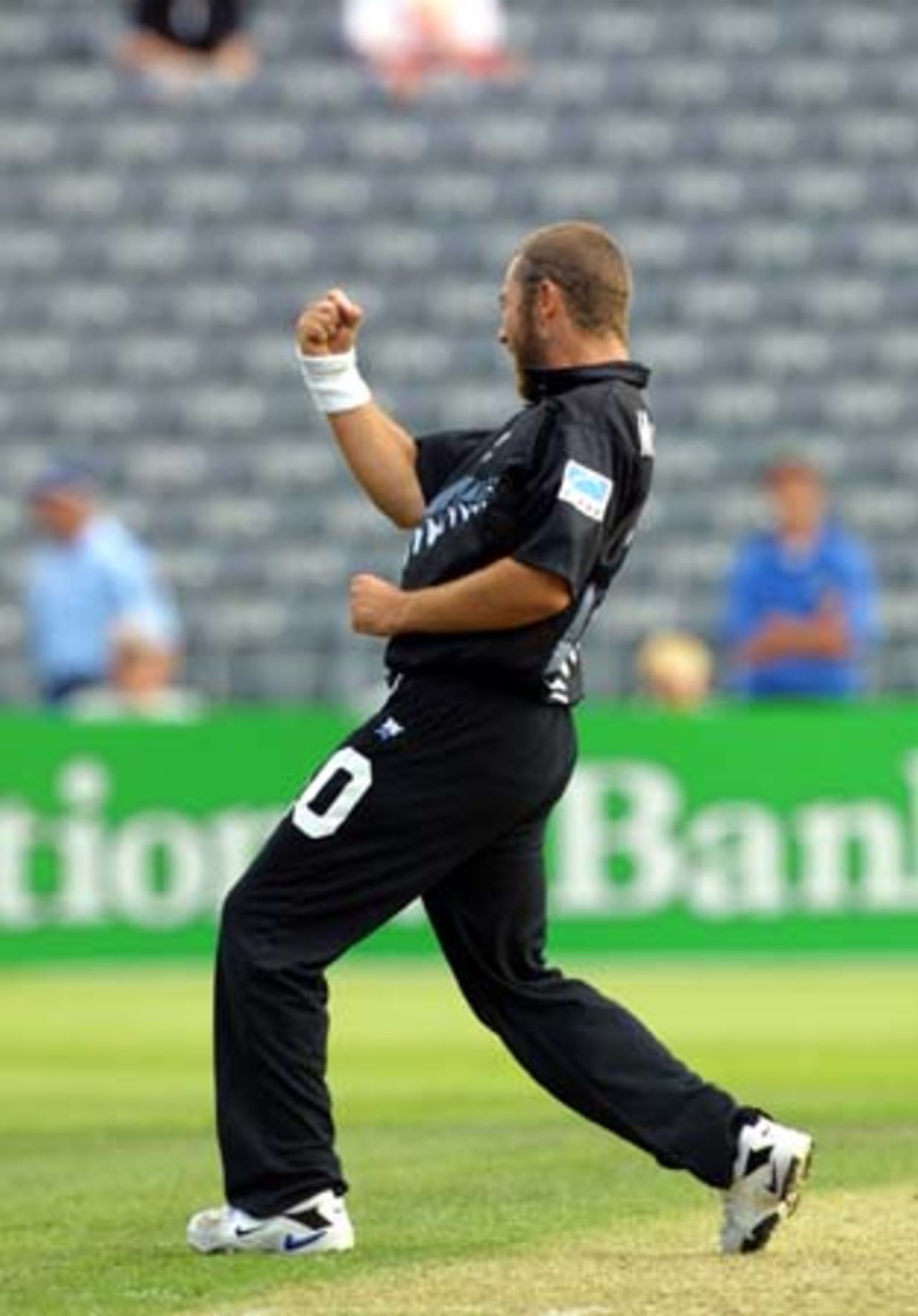 New Zealand medium fast bowler Craig McMillan pumps his fist in the air in celebration of bowling Sri Lankan lower order batsman Mutiah Muralitharan for four, to complete victory by 13 runs. 5th One-Day International: New Zealand v Sri Lanka at Jade Stadium, Christchurch, 11 February 2001.
