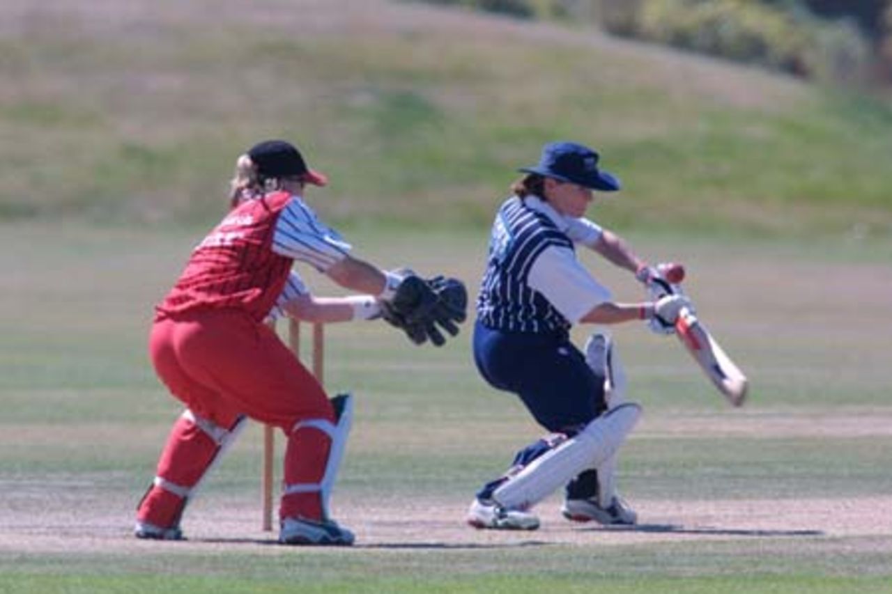 Auckland batsman Emily Drumm plays at a short ball outside off stump during her innings of 24 while Canterbury wicket-keeper Jo Strachan looks on. State Insurance Cup Final: Canterbury Women v Auckland Women at Village Green, Christchurch, 10 February 2001.
