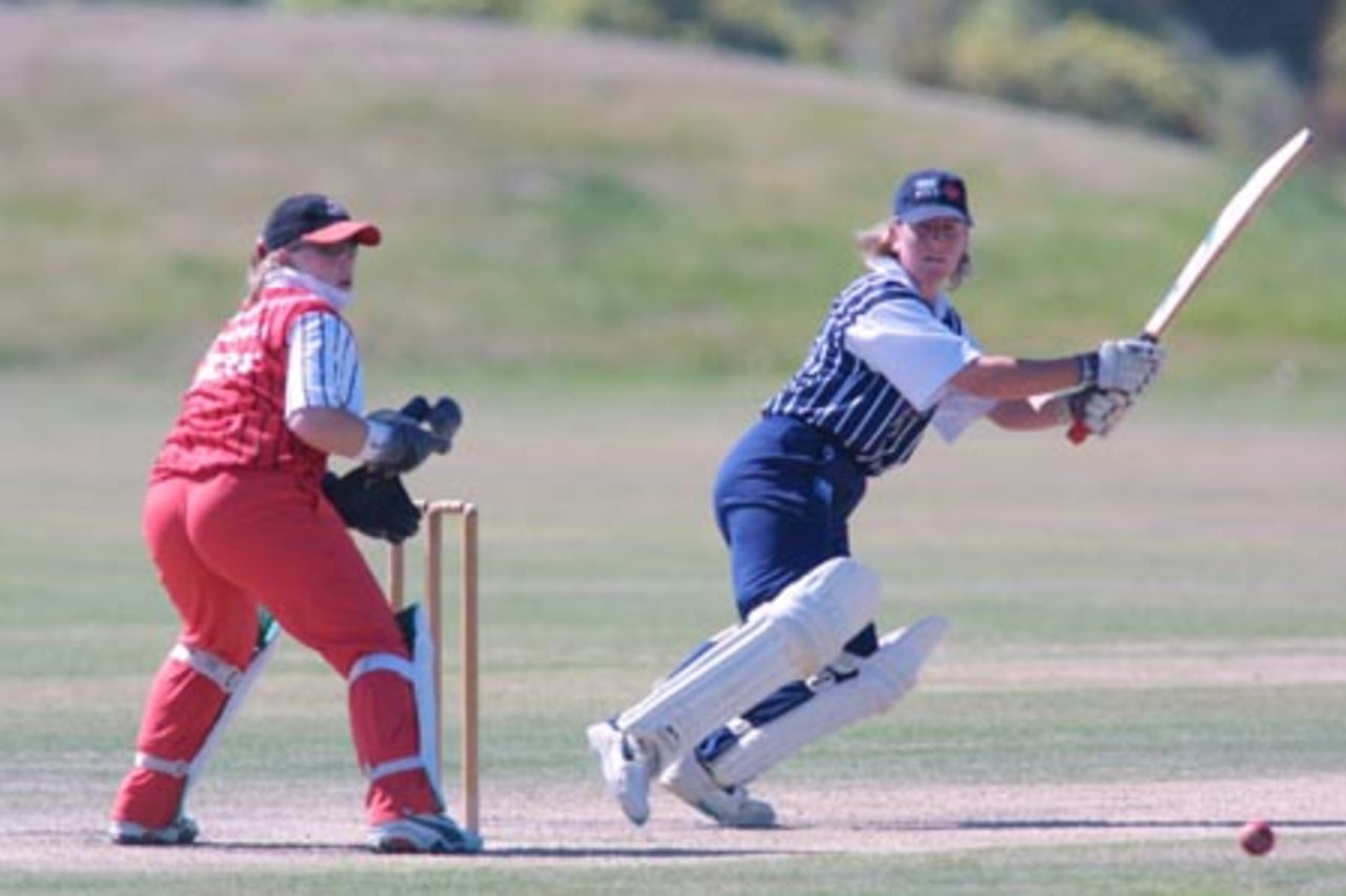 Auckland opening batsman Shelly Fruin cuts a ball through backward point during her innings of 97 while Canterbury wicket-keeper Jo Strachan looks on. State Insurance Cup Final: Canterbury Women v Auckland Women at Village Green, Christchurch, 10 February 2001.