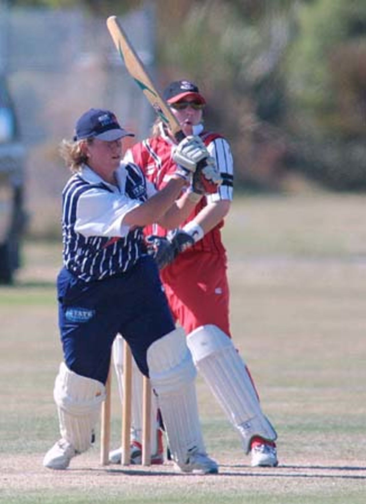 Auckland opening batsman Shelly Fruin swings a ball away through forward square leg during her innings of 97 while Canterbury wicket-keeper Jo Strachan looks on. State Insurance Cup Final: Canterbury Women v Auckland Women at Village Green, Christchurch, 10 February 2001.