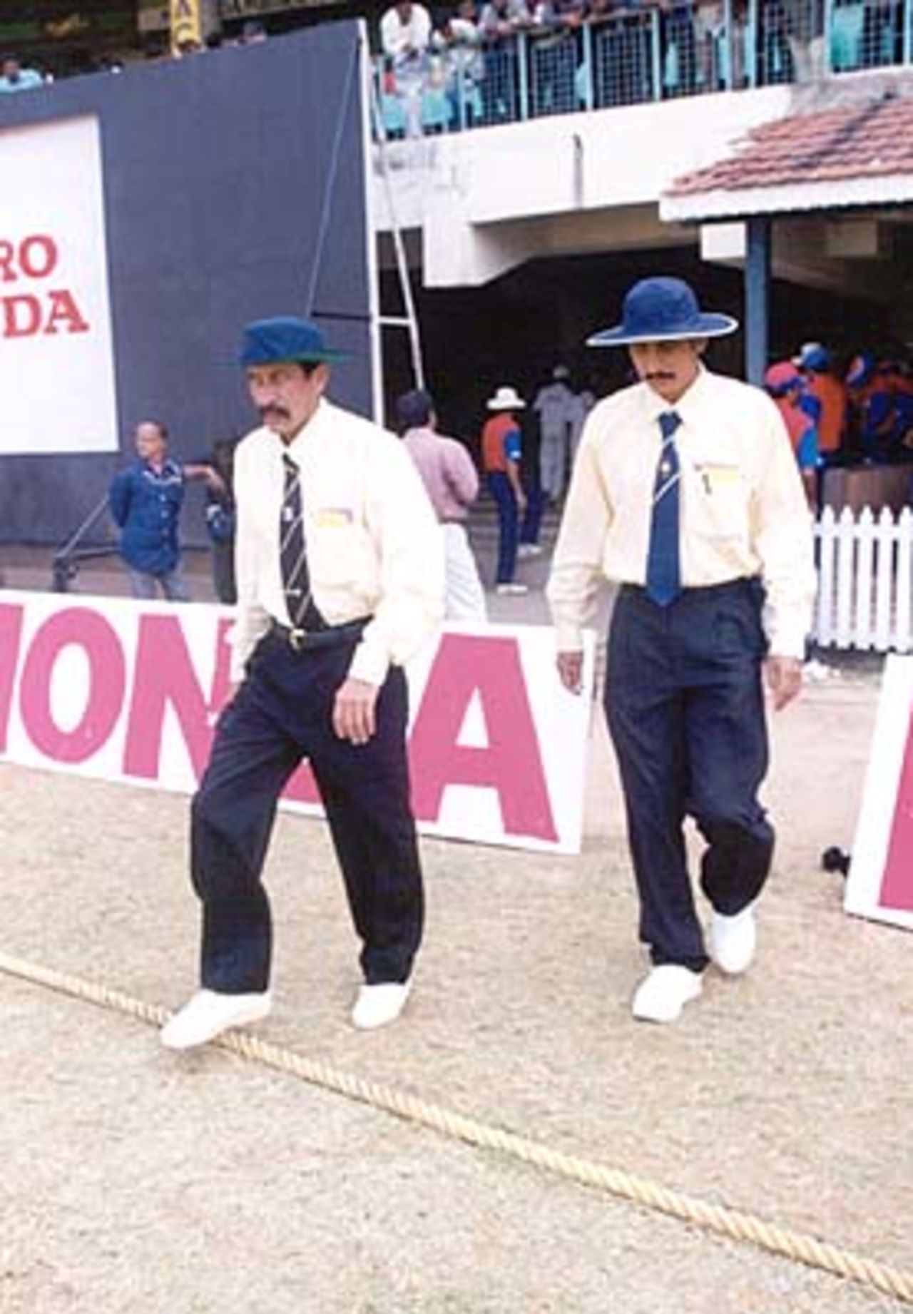The umpires SK Tarapore and S Lakshmanan make their way into the middle. Challenger Series 2000/01, India v India 'B' at MA Chidambaram Stadium, Chepauk, Chennai, 13 Feb 2001