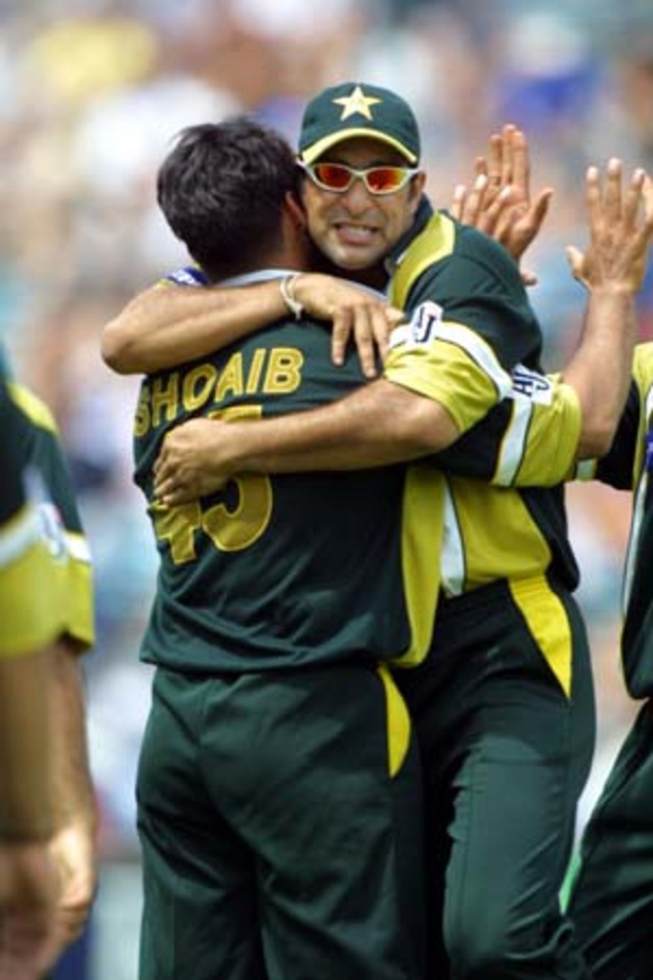 Pakistan fast bowler Shoaib Akhtar is hugged by fielder Wasim Akram upon dismissing New Zealand tail-end batsman Daryl Tuffey lbw for a golden duck to end the innings. Tuffey was Shoaib's fifth victim in a burst of five wickets for two runs in the space of 11 balls. Shoaib finished with figures of 5-19 from 6.3 overs, his first five-wicket bag in One-Day Internationals. 1st One-Day International: New Zealand v Pakistan at Eden Park, Auckland, 18 February 2001.