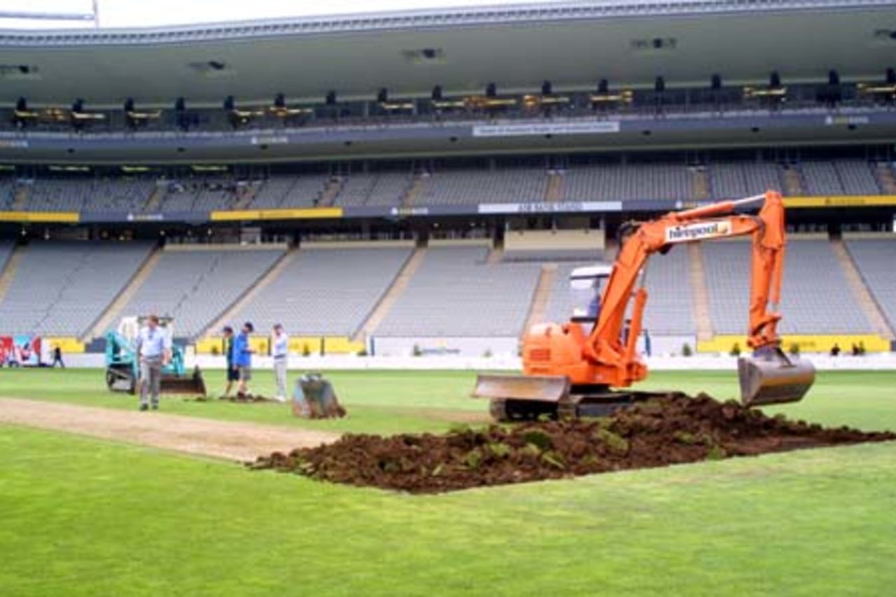 A digger starts work on replacing the Eden Park wicket block, immediately after the conclusion of the match, the final one to be played on a normal turf pitch at Eden Park. A portable pitch will be laid into the ground, to allow both cricket and rugby to co-exist at the ground during the overlapping seasons. A Super 12 rugby match will be played on March 2nd, before the portable cricket will be laid in preparation for the first Test between New Zealand and Pakistan starting on March 8th. 1st One-Day International: New Zealand v Pakistan at Eden Park, Auckland, 18 February 2001.