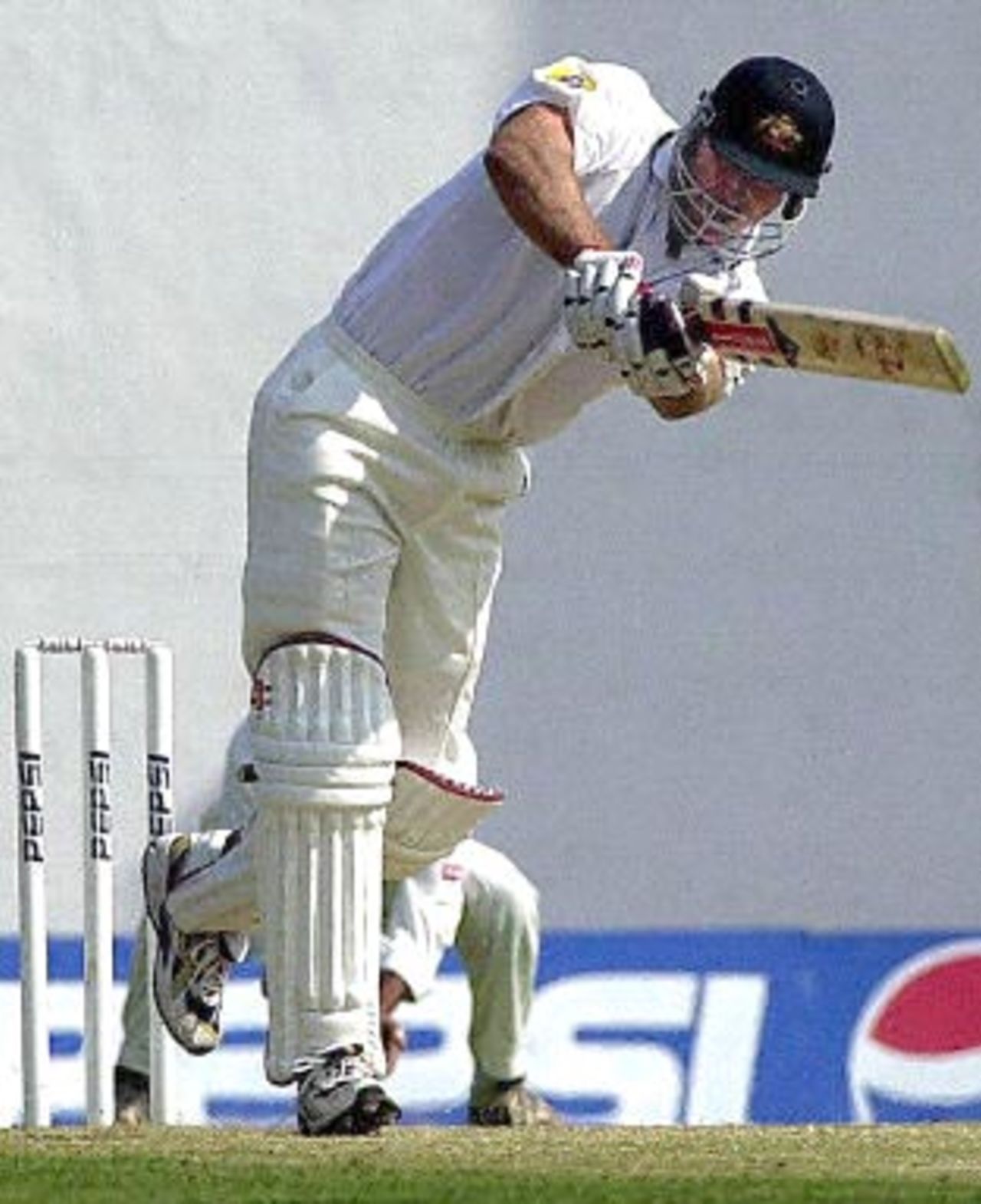 Australian batsman Mathew Hayden hits a ball to the boundary on his way to scoring an unbeaten 41 runs by lunch on the first day of the first three-day test match betwen India and Australia in Nagpur, 17 February 2001. Australia were 119 for 4 by lunch.