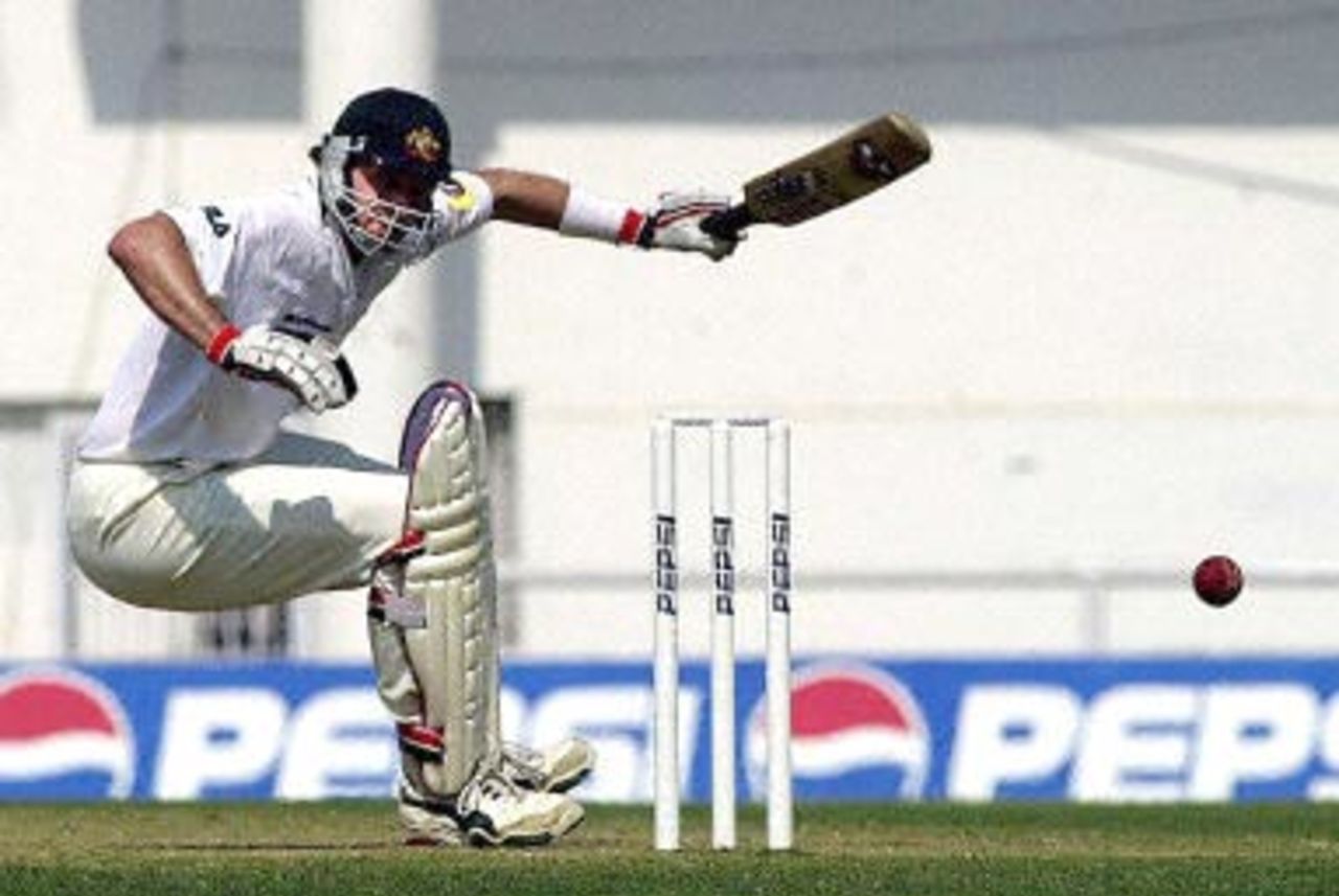 Australian batsman Michael Kasprowicz is knocked down by a delivery on the first day of the first three-day cricket match against India in Nagpur 17 February 2001. Kasprowicsz scored 92 runs as Australia were all out for 291 in their first innings.