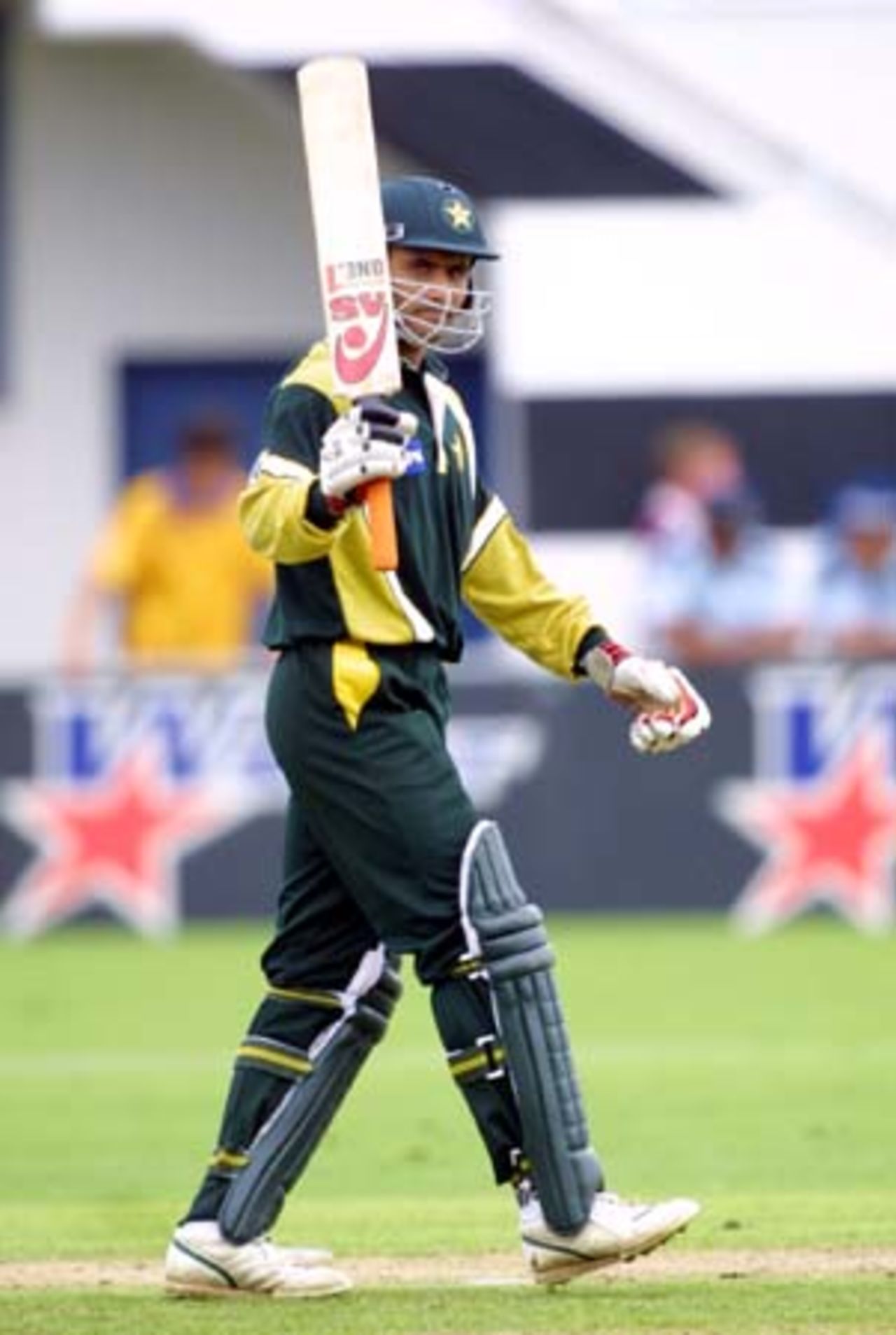 Pakistan batsman Abdur Razzaq raises his bat upon reaching his half century from 112 balls, only to be dismissed the very next ball, caught off the bowling of New Zealand fast medium bowler Chris Martin by Chris Harris for 50. 2nd One-Day International: New Zealand v Pakistan at McLean Park, Napier, 20 February 2001.
