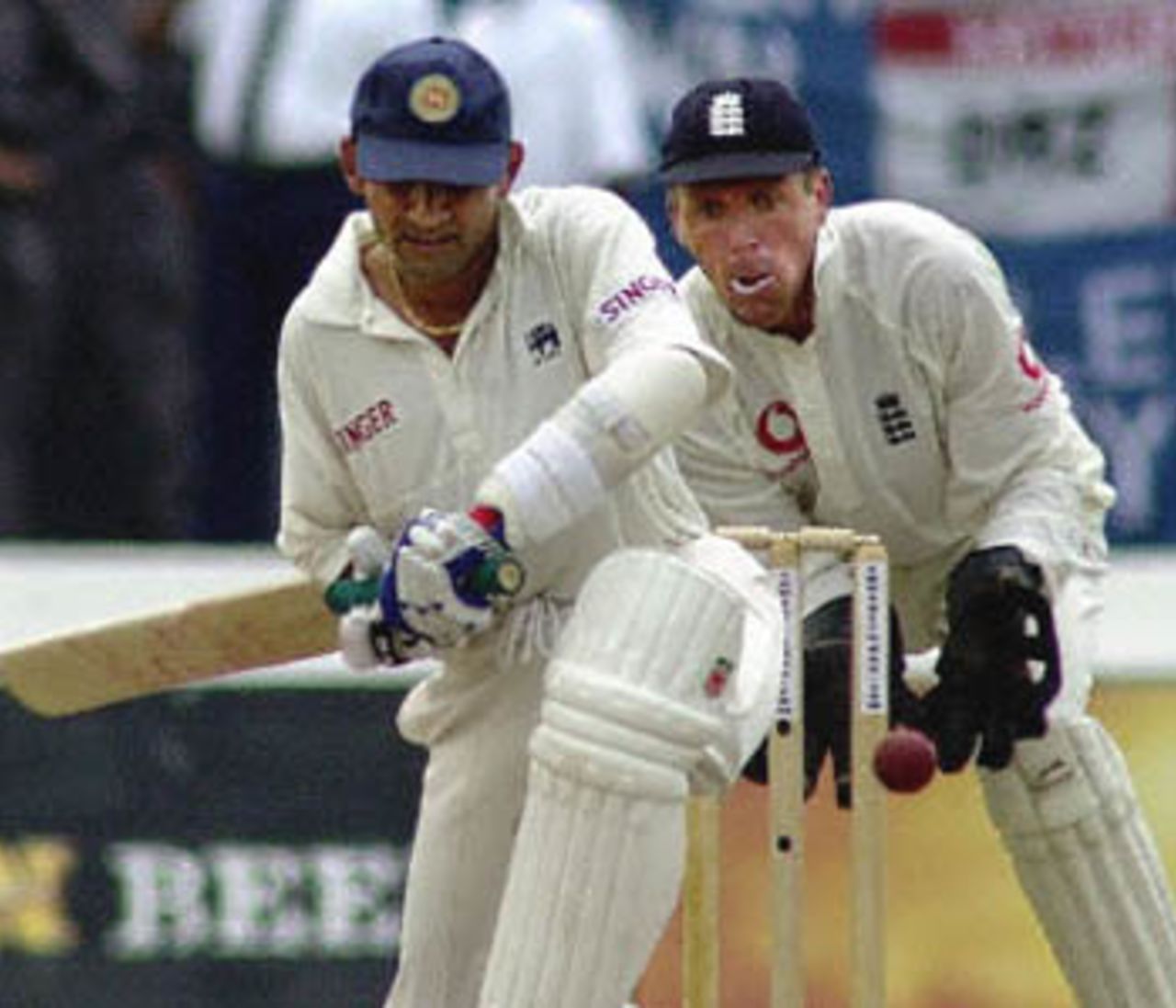 Sri Lankan batsman Marvan Atapattu (L) hits a ball on the first day of the first cricket Test match at Galle International Stadium, 22 February 2001, as England's wicketkeeper Alec Stewart (R) looks on. Sri Lanka recovered from the early loss of Sri Lankan skipper Sanath Jayasuriya for 14 to secure 70 for one wicket at lunch, with Atapattu not out at 18.