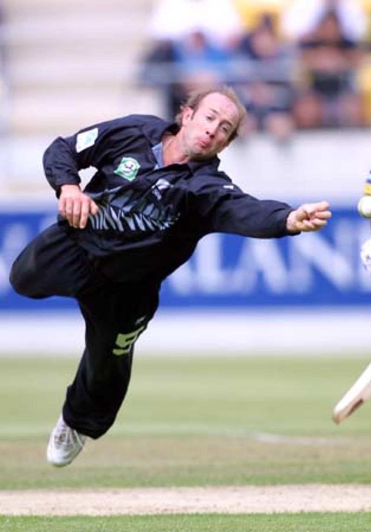 New Zealand medium pace bowler Chris Harris dives athletically to his left to partially save a powerful shot from Pakistan batsman Inzamam-ul-Haq from his bowling. 3rd One-Day International: New Zealand v Pakistan at WestpacTrust Stadium, Wellington, 22 February 2001.