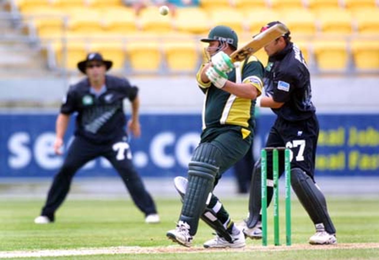 Pakistan batsman Inzamam-ul-Haq plays a cut shot at a ball from New Zealand medium pace bowler Chris Harris, only to top edge it straight to Roger Twose (lining it up in the background at short third man) to be dismissed for 12. Wicket-keeper Adam Parore looks on behind the stumps. 3rd One-Day International: New Zealand v Pakistan at WestpacTrust Stadium, Wellington, 22 February 2001.