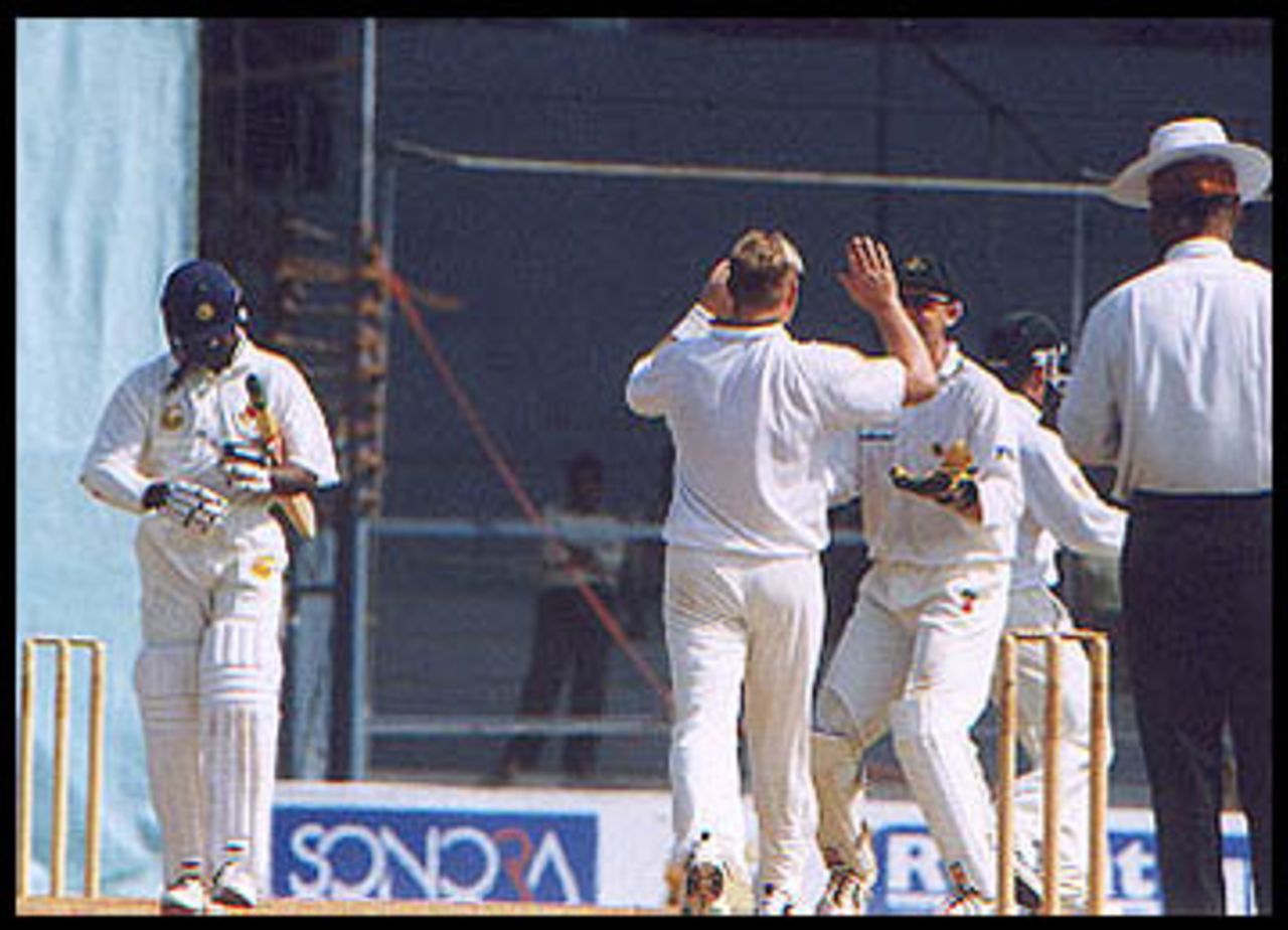 Warne celebrates the fall of Kambli with Gilchrist. Australia in India 2000/01, Mumbai v Australians, Brabourne Stadium, Mumbai, 22-24 Feb 2001 (Day 3)