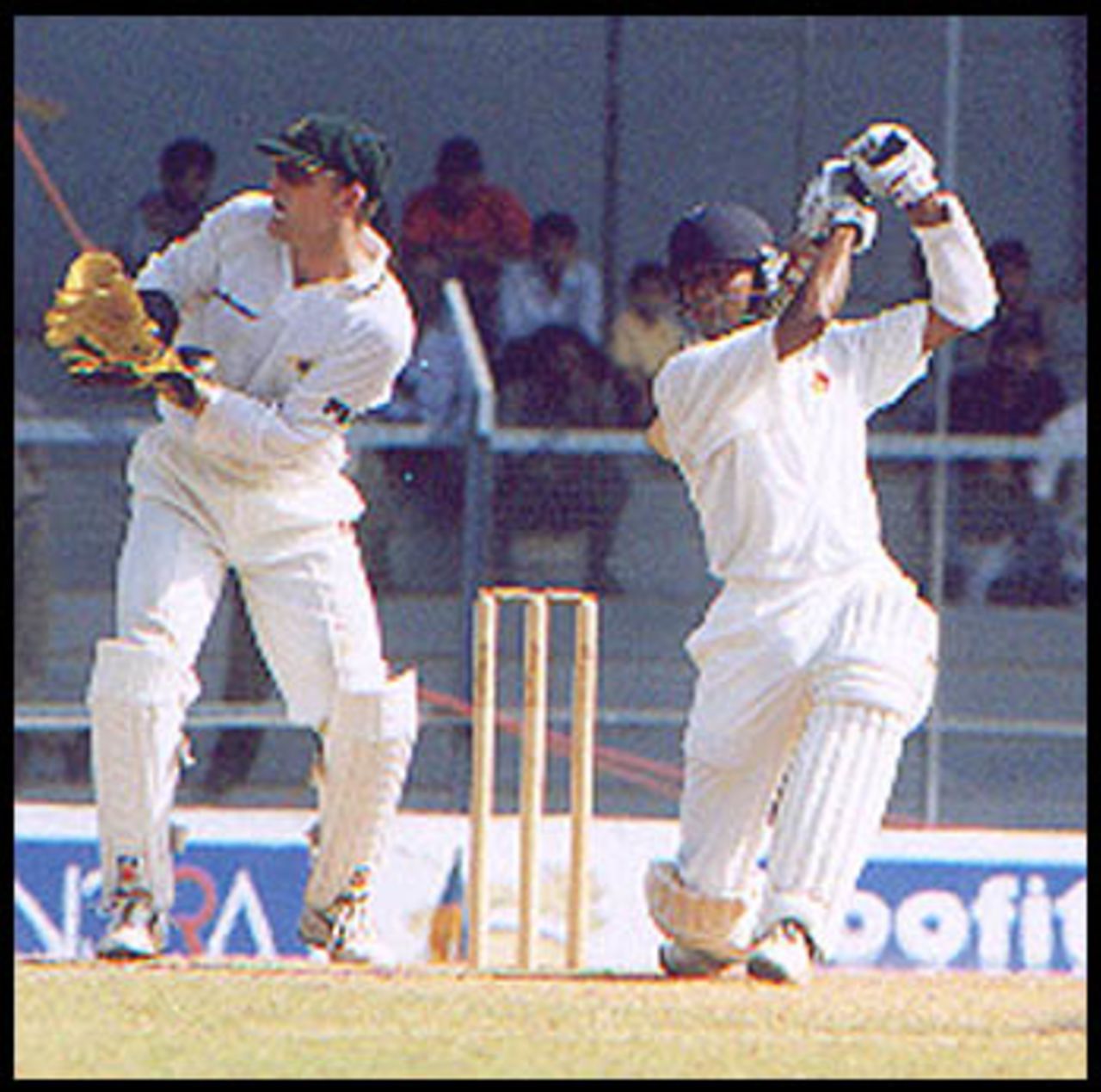 Jaffer plays a cover drive as Gilchrist looks on. Australia in India 2000/01, Mumbai v Australians, Brabourne Stadium, Mumbai, 22-24 Feb 2001 (Day 3).