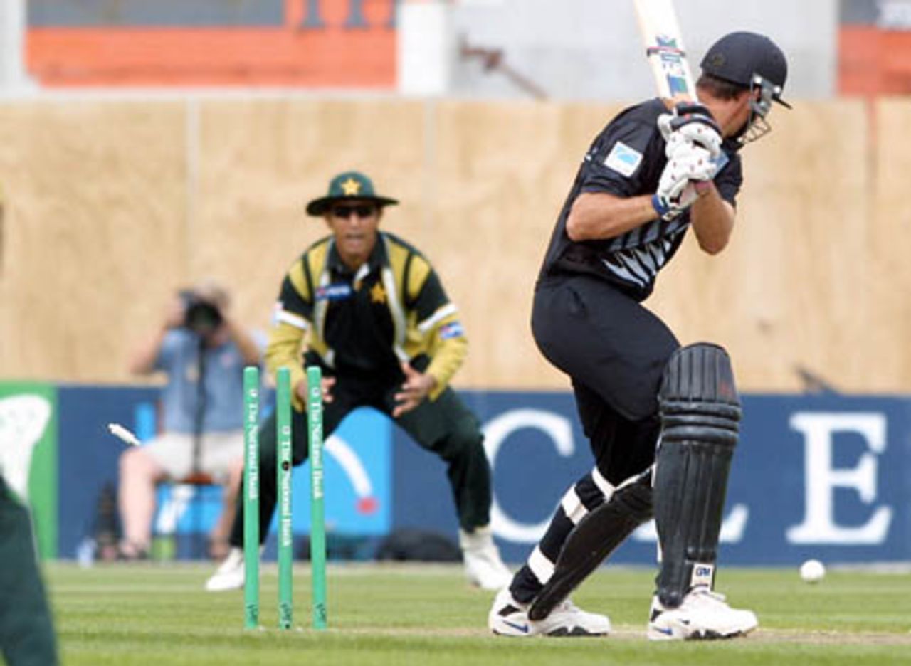Fast Fielder Fleming drags a ball from Waqar on to his stumps | ESPNcricinfo.com