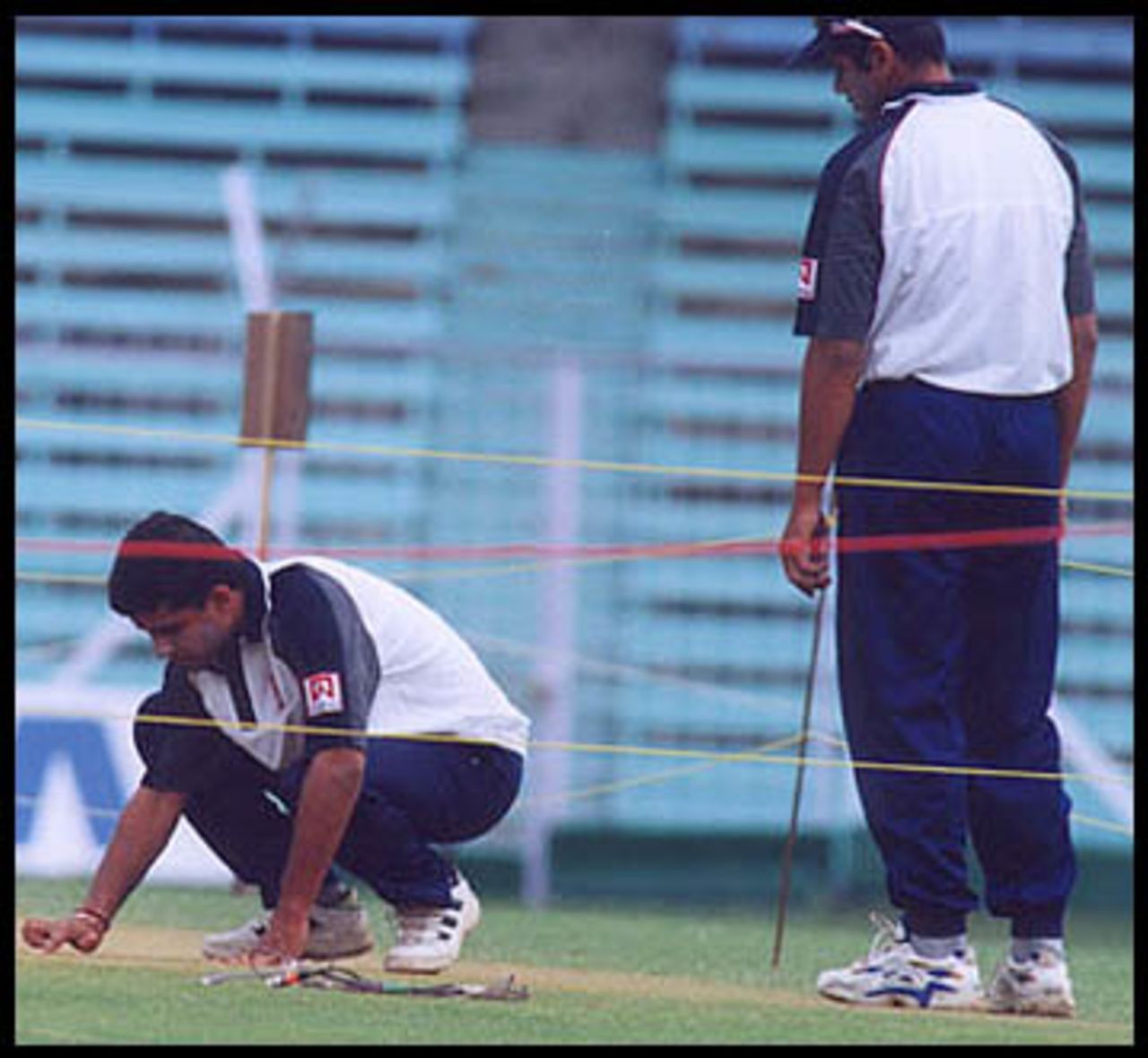Ganguly closely examining the playing surface at Wankhede Stadium, 26 Feb 2001.