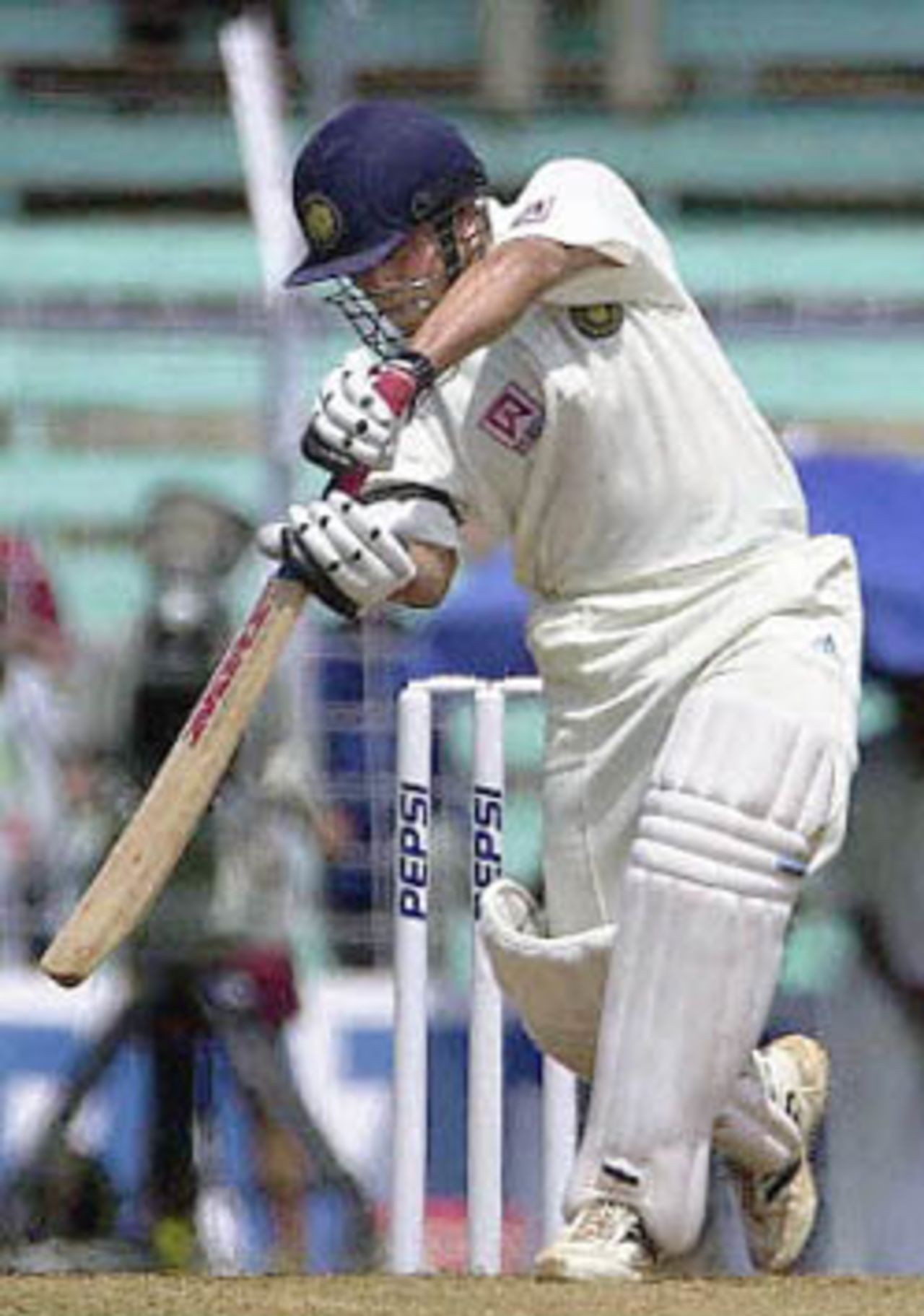 Indian batsman Sachin Tendulkar hits a delivery to the boundary on the opening day of the first Test match between Indian and Australia at Wankhade stadium in Bombay, 27 February 2001. Tendulkar scored a valuable 76 runs as the India were struggling at 140 for 7 wickets.