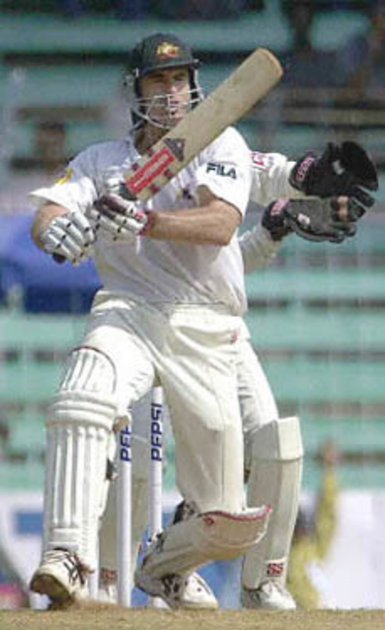 Australian batsman Matthew Hayden pulls a delivery to the fence on way to scoring an unbeaten 81 runs by lunch on the second day of the first test match between India and Australia at Wankhade stadium in Bombay 28 February 2001. Hayden's knock steadied Australia's staggering first innings to 170 for 5 by lunch in reply to India's 176 runs.
