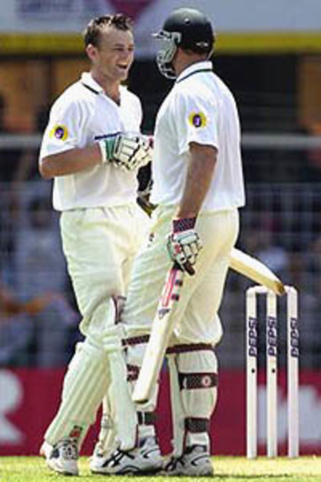28 Feb 2001: Adam Gilchrist of Australia is congratulted by team mate Matthew Hayden after reaching 100, during day two of the first test between India and Australia, played Wankhede Stadium, Mumbai, India.