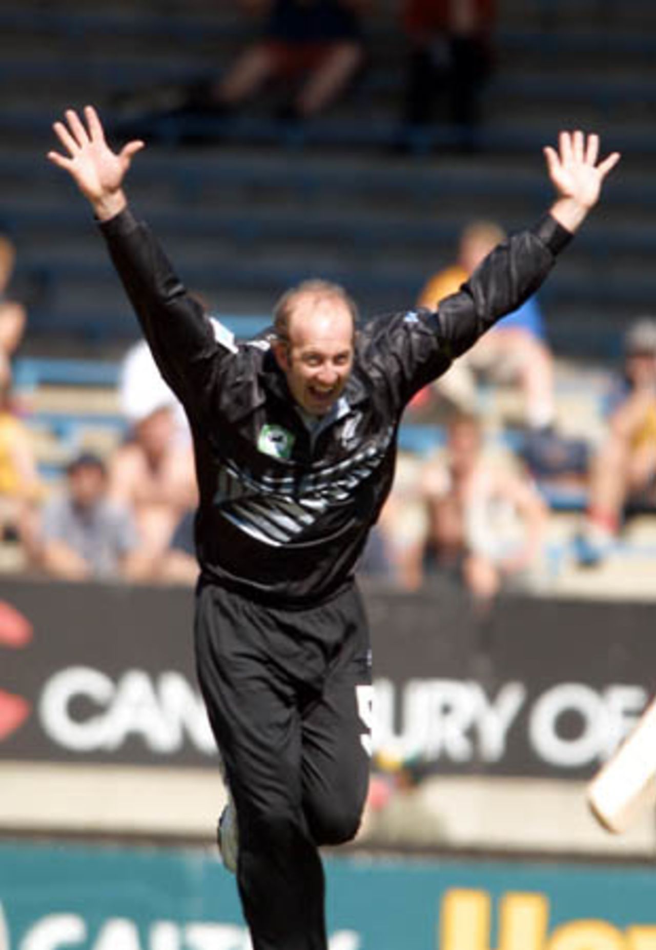 New Zealand medium pace bowler Chris Harris raises his arms in celebration of dismissing Pakistan batsman Shahid Afridi, caught behind by wicket-keeper Adam Parore for 65. 5th One-Day International: New Zealand v Pakistan, Carisbrook, Dunedin, 28 February 2001.
