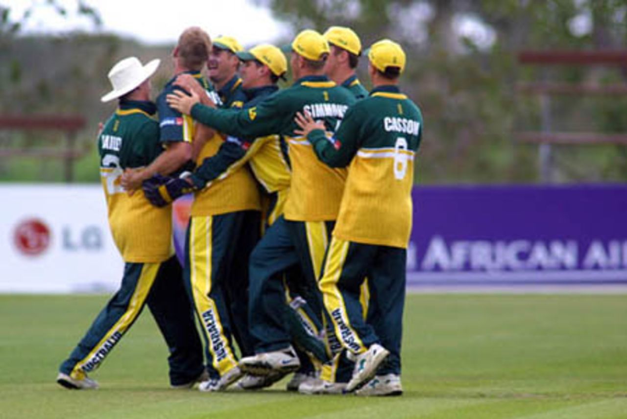 Australia Under-19 players celebrate the dismissal of New Zealand Under-19 batsman Rob Nicol, caught by George Bailey (left) from the bowling of Cameron White (second from left) for 25. ICC Under-19 World Cup Super League Group 2: Australia Under-19s v New Zealand Under-19s at Bert Sutcliffe Oval, Lincoln, 1 February 2002.