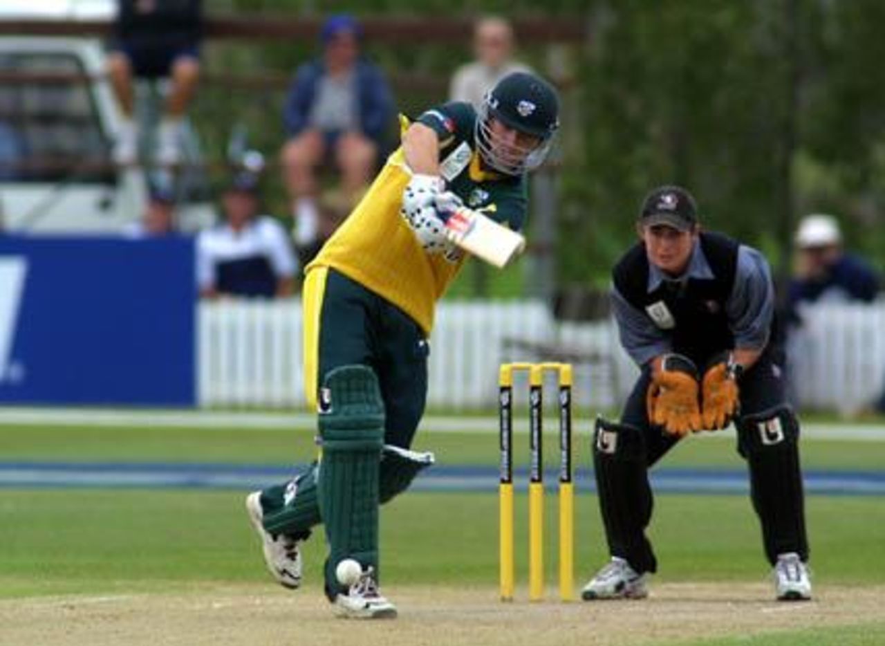 Australia Under-19 batsman Shaun Marsh drives a delivery down the ground during his innings of 70. Wicket-keeper Simon Allen looks on. ICC Under-19 World Cup Super League Group 2: Australia Under-19s v New Zealand Under-19s at Bert Sutcliffe Oval, Lincoln, 1 February 2002.
