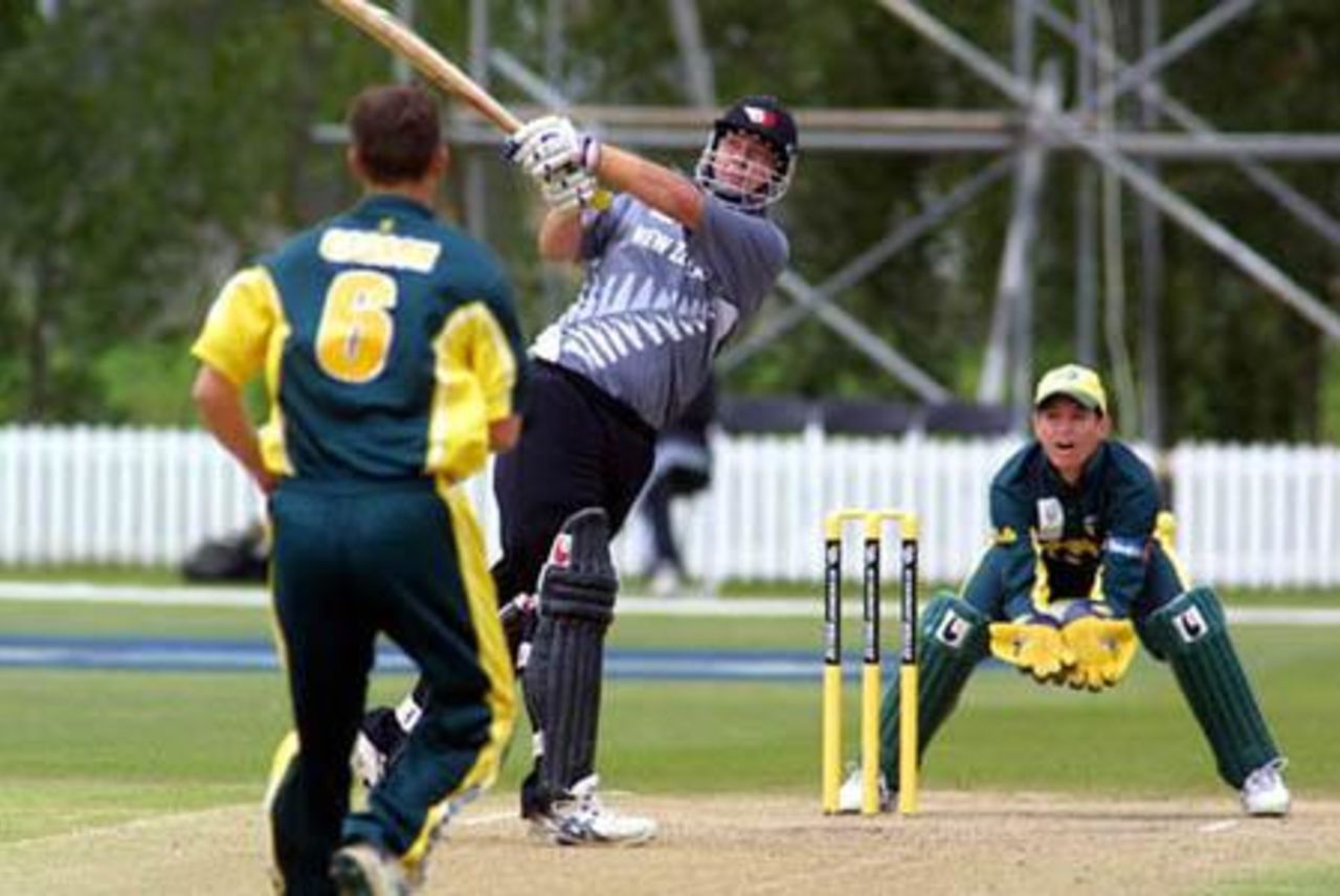 New Zealand Under-19 batsman Jesse Ryder hits a delivery from Australia Under-19 bowler Beau Casson for six over long on during his innings of 70. Wicket-keeper Adam Crosthwaite looks on. ICC Under-19 World Cup Super League Group 2: Australia Under-19s v New Zealand Under-19s at Bert Sutcliffe Oval, Lincoln, 1 February 2002.