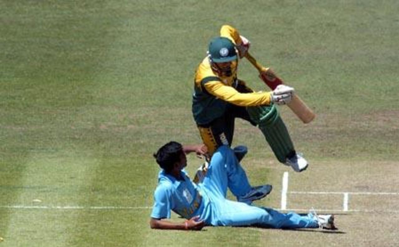 South Africa Under-19 batsman Hashim Amla collides with India Under-19 bowler Rakesh Mohanty as he attempts a run. 1st ICC Under-19 World Cup Super League Semi Final: India Under-19s v South Africa Under-19s at Bert Sutcliffe Oval, Lincoln, 3 February 2002.