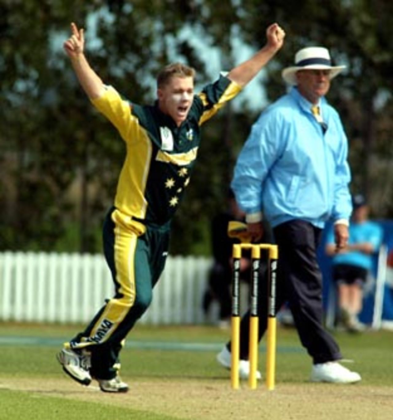 Australia Under-19 bowler Xavier Doherty celebrates the dismissal of West Indies Under-19 batsman Narsingh Deonarine, caught by Beau Casson for 40. Umpire Steve Dunne looks on. 2nd ICC Under-19 World Cup Super League Semi Final: Australia Under-19s v West Indies Under-19s at Bert Sutcliffe Oval, Lincoln, 6-7 February 2002 (7 February 2002).