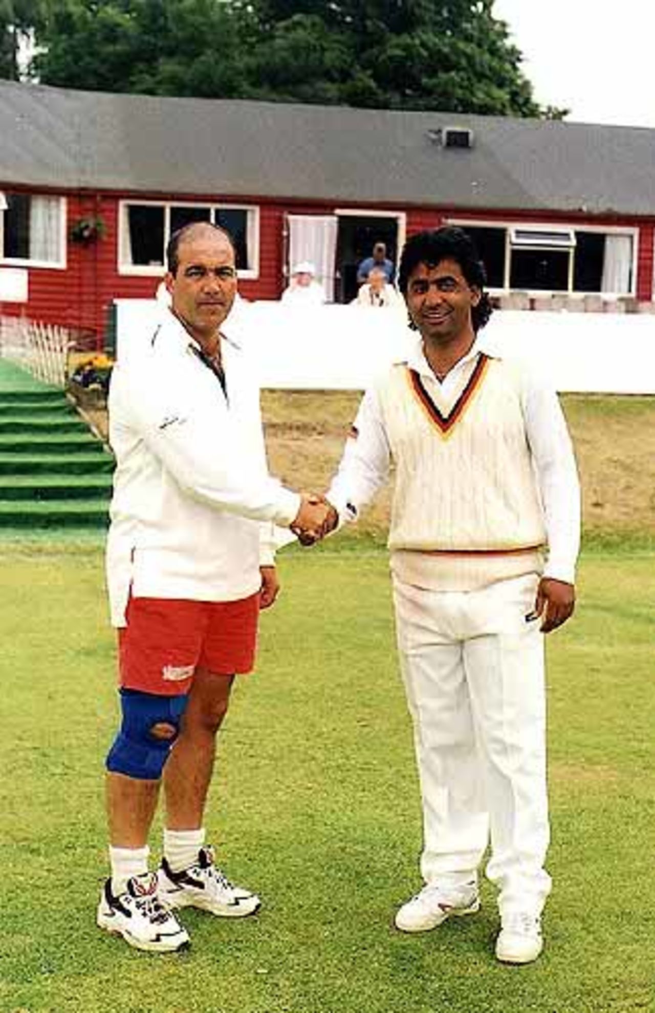 The captains of Gibralter and Germany shake hands prior to their match