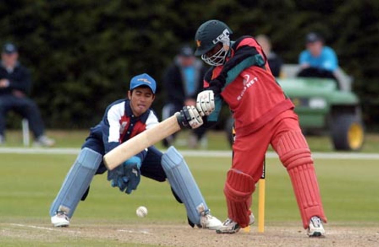 Zimbabwe Under-19 batsman Tatenda Taibu shapes to cut a delivery during his innings of 65 not out. Nepal Under-19 wicket-keeper Manoj Katuwal looks on. ICC Under-19 World Cup Plate Championship Final: Nepal Under-19s v Zimbabwe Under-19s at Lincoln No. 3, Lincoln, 8 February 2002.