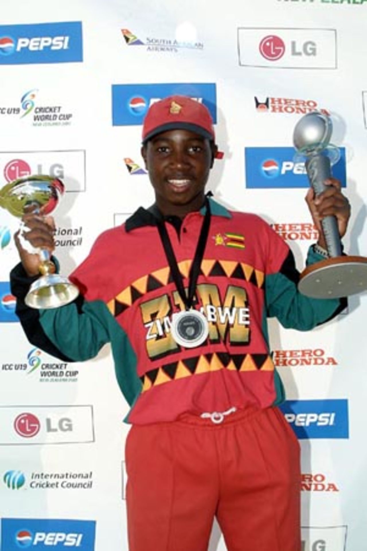 Zimbabwe Under-19 captain Tatenda Taibu celebrates being named Player of the Tournament and winning the Plate Championship with the two trophies. ICC Under-19 World Cup Plate Championship Final: Nepal Under-19s v Zimbabwe Under-19s at Lincoln No. 3, Lincoln, 8 February 2002.