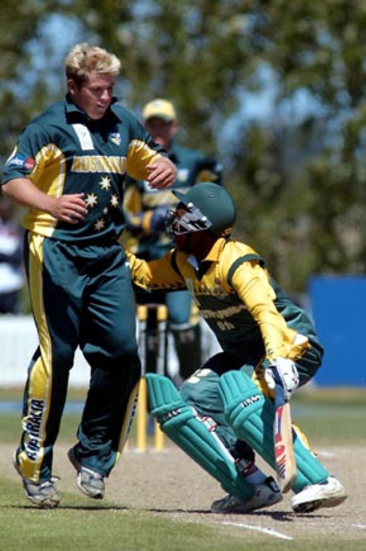 South Africa Under-19 batsman Zwelibanzi Homani (right) makes contact with Australia Under-19 bowler Mark Cosgrove as he turns for a second run during his innings of 52 not out. ICC Under-19 World Cup Super League Final: Australia Under-19s v South Africa Under-19s at Bert Sutcliffe Oval, Lincoln, 9 February 2002.