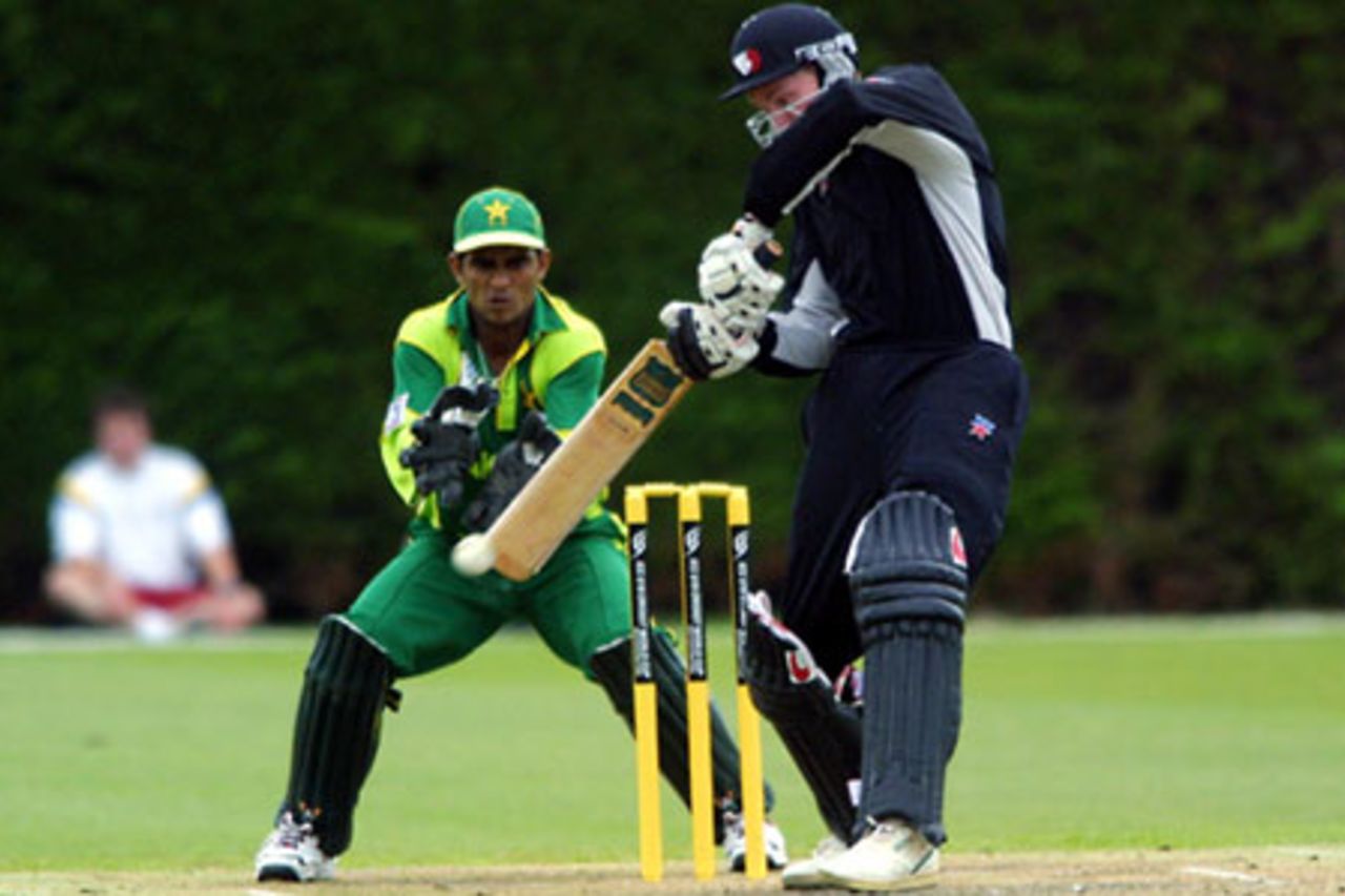 New Zealand Under-19 batsman Stephen Murdoch forces a delivery on the off side during his innings of 44. Pakistan Under-19 wicket-keeper Amin-ur-Rehman looks on. ICC Under-19 World Cup Warmup: New Zealand Under-19s v Pakistan Under-19s at Lincoln No. 3, Lincoln, 17 January 2002.