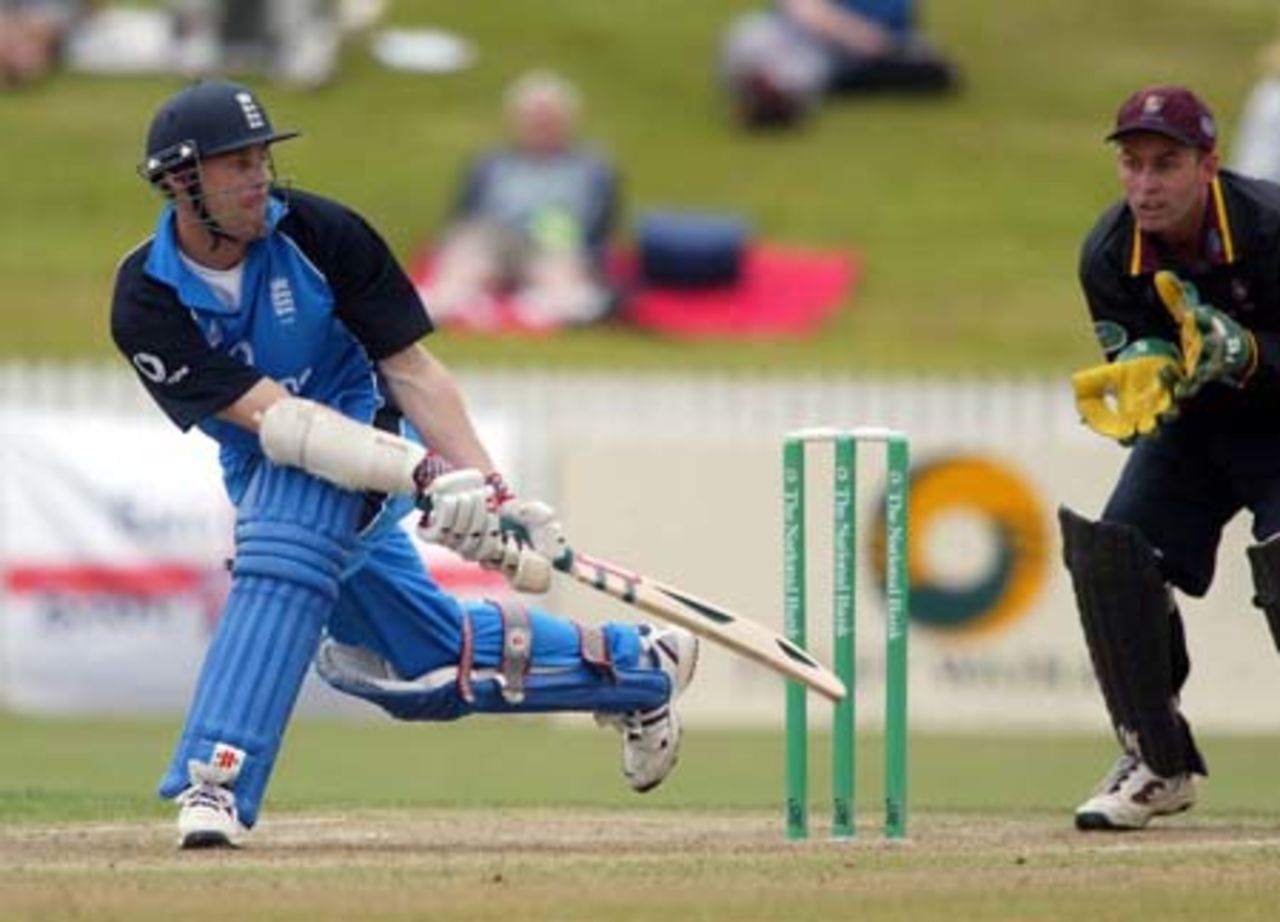 England batsman Nick Knight plays a reverse sweep during his innings of 126. Northern Districts wicket-keeper Robbie Hart looks on. Tour match: Northern Districts v England at WestpacTrust Park, Hamilton, 8 February 2002.