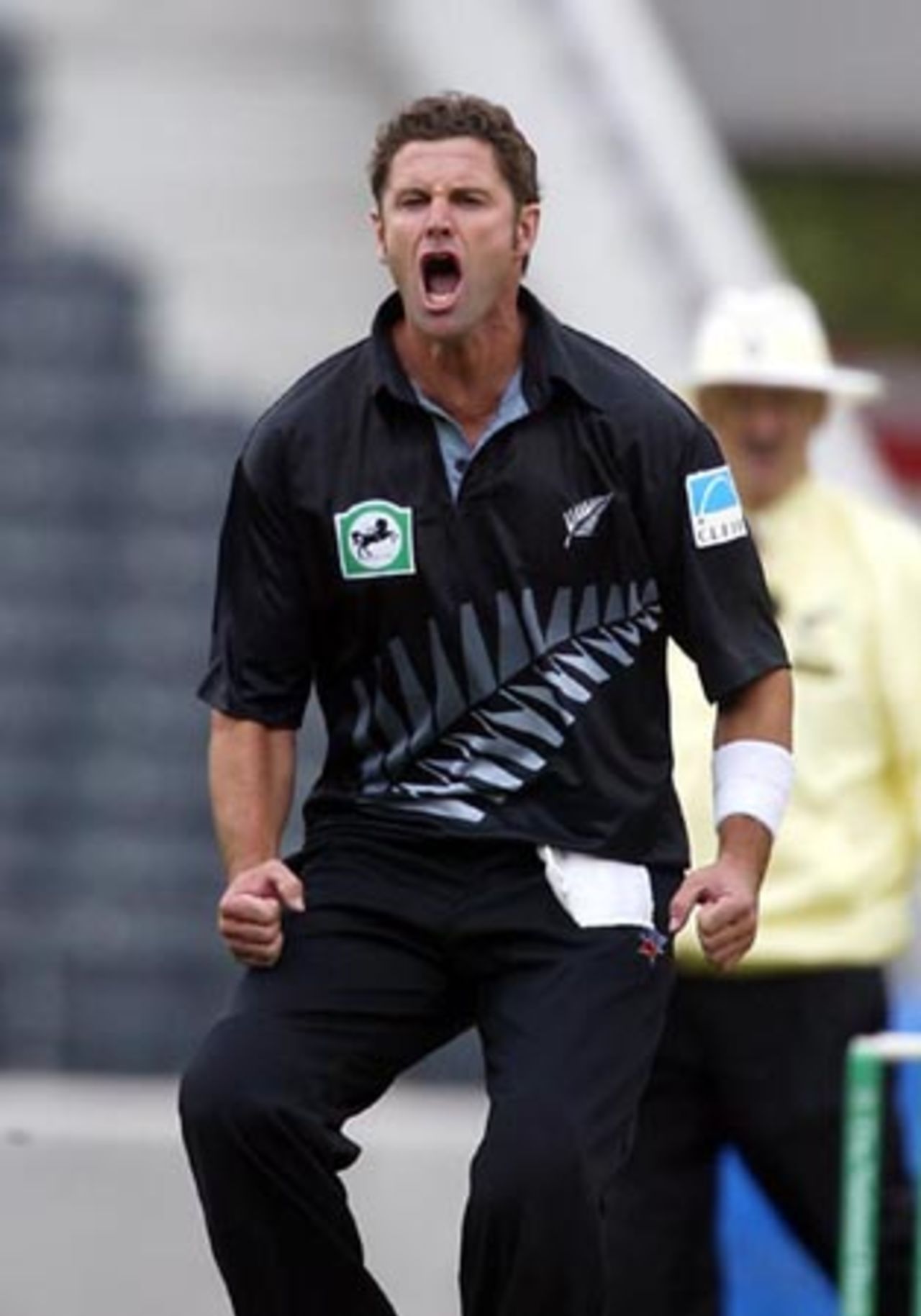 New Zealand bowler Chris Cairns shouts in frustration as wicket-keeper Chris Nevin drops England batsman Nick Knight off his bowling during his spell of 2-43 from nine overs. Umpire Evan Watkin looks on in the background. 1st ODI: New Zealand v England at Jade Stadium, Christchurch, 13 February 2002.